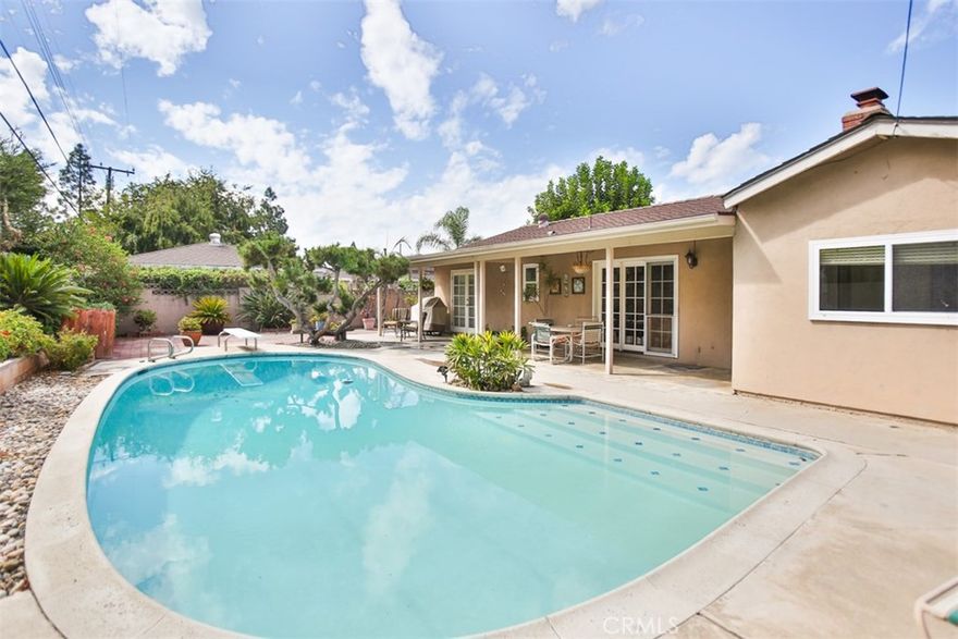 Welcome to your dream home! Nestled in a quiet neighborhood, this beautiful single-story 3-bedroom, 2-bathroom home offers a perfect blend of comfort, style and convenience. Step inside through the front entrance and be greeted by a welcoming floor plan and an abundance of windows that fill the home with natural light. The layout is both functional and welcoming. Enjoy the best of Southern California living in the spacious, private backyard, complete with a sparkling swimming pool and patio—perfect for unwinding or dining al fresco. Located just minutes from Disneyland, Angel Stadium, The Honda Center, and Anaheim Coves (perfect for walking, biking and golf), this home provides easy access to freeways, shopping, dining and entertainment.