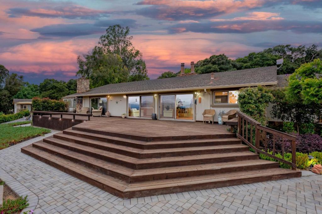 Las Brisas Ranch.. Where Bay Area convenience meets country serenity. This gated 6.61-acre estate in San Juan Bautista offers sweeping panoramic views and the freedom to live life at your pace with usable land, and versatile living spaces. The beautifully updated main home features engineered hardwood floors, three fireplaces, and a chef's kitchen with quartz countertops, custom cabinetry, and high-end built-in appliances. The detached guest house includes vaulted ceilings, hardwood floors, and a full kitchen, ideal for extended family, guests, or remote work. Outdoor living shines with a large wood deck, patio room, and paver patio overlooking peaceful pastures. The property is fenced and cross-fenced, with a great gallon per minute private well, two separate septic systems and Duel PG&E meters. Propane generator. Additional features include a security gate, sun tunnels, dual-pane windows, raised-panel doors, ceiling fans, and storage for toys. The land is ideal for horses, vineyards, gardening, recreation or simply enjoying wide open space with fresh air. A rare opportunity to own a private retreat with modern upgrades and timeless country charm. Conveniently located near downtown San Juan Bautista, the Monterey Bay coastline, and the Bay Area.