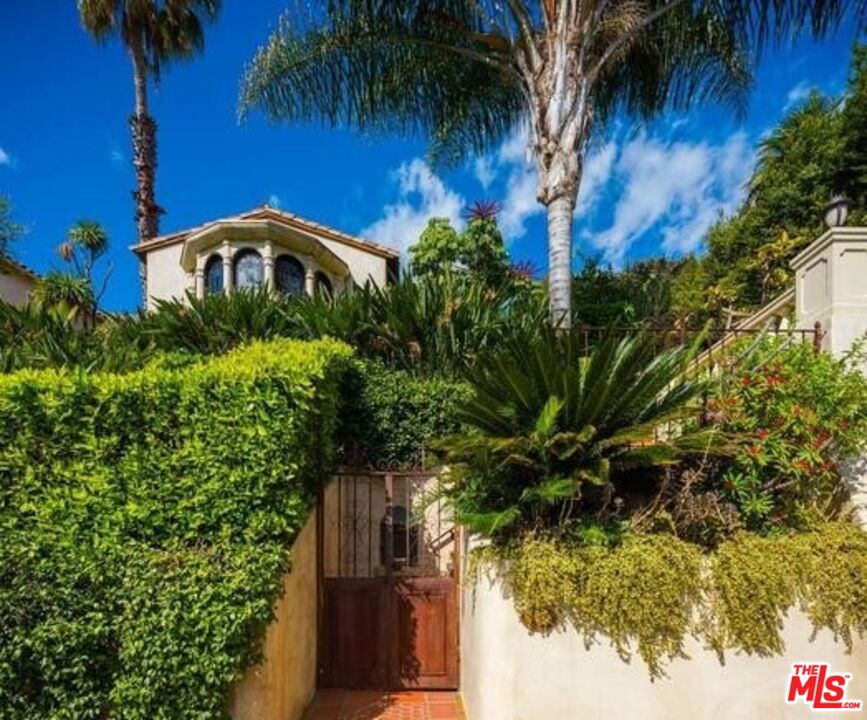 Elevated above the city in the infamous Hollywood Hills, this exquisite Mediterranean estate embodies timeless and serene luxury. Featuring 3 bedrooms and 3 bathrooms, every detail of the residence has been thoughtfully curated from elegant archways and rich finishes to sweeping open spaces bathed in natural light. The resort-style backyard is a true sanctuary, complete with a shimmering pool and panoramic views that unveil a fabulous view of the city. Perfectly positioned for privacy yet moments away from the vibrancy of the Sunset Strip.