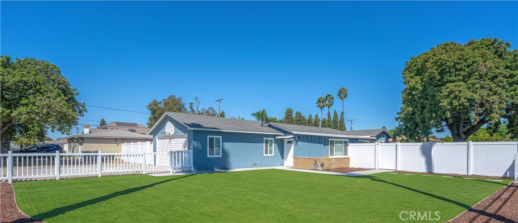Enjoy the curb appeal from this white picket fence home! This fully remodeled 4bd, 1ba home sits on a lot with over 10k square feet of enclosed yard space, which is perfect for those family outdoor gatherings. Upon entry you will appreciate the new paint and modern, hard surface flooring throughout, updated kitchen with Shaker cabinets and new countertops, with stainless steel stove and dishwasher included. Stay comfortable in all temperatures with central heat, AC, and ceiling fans. New bathroom with shower over tub and sleek slate tile flooring. The 4th bedroom would make a great office or bonus room with direct access from the sliding door to the outdoor space. The 2-car garage features washer/dryer hookups, overhead storage and additional driveway parking. With low maintenance landscaping on an oversized lot, the possibilities are endless for a true indoor/outdoor living experience that can be created from this quaint California coastal cottage.
Conveniently located with quick access to the 22 and 405 Freeways, and just blocks from the famous Mile Square Regional Park. Don't miss out on being the first to occupy this newly remodeled Santa Ana gem!