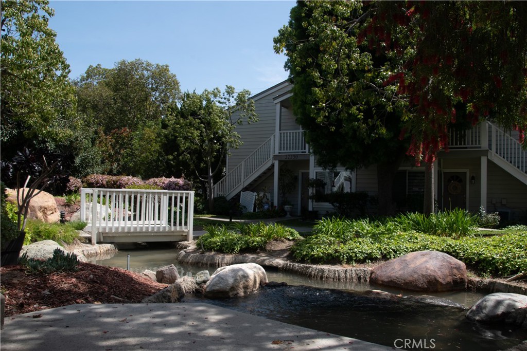 Gated Harbor Spring Community. Beautiful Cape Cod Style condo. 2 Spacious master bedrooms with lots of closet space and own bathrooms. Fireplace in living
room. Both bathrooms and kitchen were renovated. Tiled and laminated wood floor. Located on the ground level near by parking. Open Patio with water creek.
Extra large laundry room with lots of storage. Two side by side assigned carport parking. HOA includes water, trash, pool and spa.