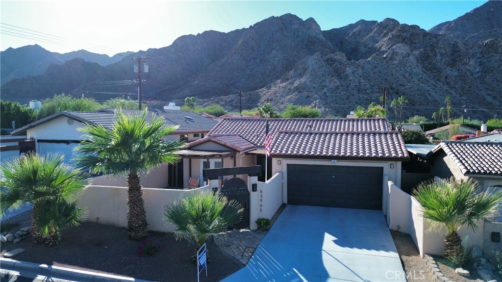 Nestled in the coveted upper La Quinta Cove, this meticulously maintained home perfectly captures the desert lifestyle with breathtaking Santa Rosa Mountain views from both the front and back.
Thoughtfully designed to maximize indoor-outdoor living, this 3-bedroom, 2.5-bath residence features a rare dual-patio layout: relax poolside under the covered back patio complete with ceiling fan and misting system, or retreat to the private enclosed front courtyard where you can sip your morning coffee while watching hummingbirds visit the fountain as sunrise illuminates the mountain peaks.
Inside, soaring vaulted ceilings and a skylight fill the open-concept living spaces with natural light, creating an airy, spacious ambiance throughout. The primary bedroom and living area flow seamlessly to the pool and patio through French doors, ideal for effortless entertaining. The kitchen offers granite countertops and ample storage, while a versatile bonus room with dual French doors opening to the front patio serves perfectly as an office, art studio, or breakfast nook.
Recent upgrades include fresh interior paint, new HVAC system, and updated appliances including dishwasher, range, refrigerator, and disposal. The low-maintenance desert landscaping features river rock and mature palms, designed specifically for the Coachella Valley climate.
Beyond your private sanctuary, experience everything the Cove lifestyle offers: hiking trails just steps away, Old Town La Quinta's acclaimed dining and weekly Farmers Market minutes down the road, and world-class golf, the Indian Wells Tennis Garden, and Acrisure Arena all nearby. You're just 30 minutes from Palm Springs and Indio's renowned music festivals.
This is more than a home—it's your gateway to the quintessential La Quinta Cove experience.
Schedule your private showing today.