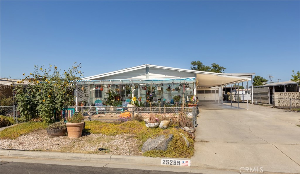 Check out this 3 bedroom, 2 bath home w/covered RV access, a full-length carport and a two-car garage in an all age neighborhood of East Hemet. The home has 1,536 sqft and an enclosed patio room for additional living space. Kitchen w/garden window & a breakfast bar that opens up to the eating area with a built-in hutch and spacious living room w/fireplace. Bedrooms are good-sized, and the primary bedroom has a walk-in closet and separate shower & soaking tub. Solar panels have been installed to keep those electrical bills down. Close to shopping & restaurants. Low taxes and no HOA.