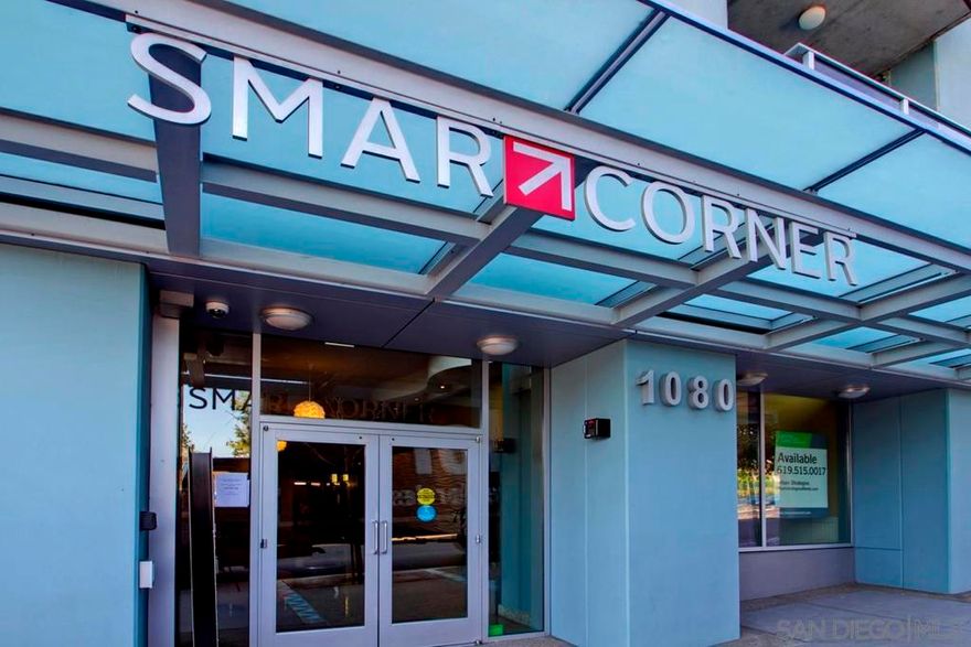 Welcome to Smart Corner, where modern design meets the energy of city living. This expansive 5th-floor corner unit offers 1,422 square feet of stylish, open-concept space with soaring ceilings, exposed concrete accents, and walls of windows that flood the home with natural light. Freshly painted and upgraded with high-quality vinyl wood-plank flooring, this home seamlessly blends sophistication with comfort.  The spacious kitchen is perfect for gathering, featuring a central island with a breakfast bar,  stainless steel appliances, and ample cabinetry. The open floor plan flows seamlessly into the living and dining areas, while a large covered balcony invites you to enjoy sweeping city views. The split-bedroom layout with 2 well-defined bedroom areas, with a generous primary suite boasting a walk-in closet and ensuite bath, plus an open secondary bedroom area and full bath ideal for guests or a home office.  This home includes in-unit laundry and two tandem parking spaces, offering convenience and ease of living. At Smart Corner, you’ll enjoy resort-style amenities including a rooftop terrace with 360° views of the city and bay, a community garden, BBQ area, hot tub, gym, and onsite management with security.  Perfectly situated, you’re just blocks from Balboa Park and minutes from Downtown, Little Italy, Petco Park, and San Diego Bay, with easy access to freeways and public transit. Experience the very best of urban living in one of San Diego’s most vibrant communities.  Technically, this is a zero-bedroom/studio with open rooms.