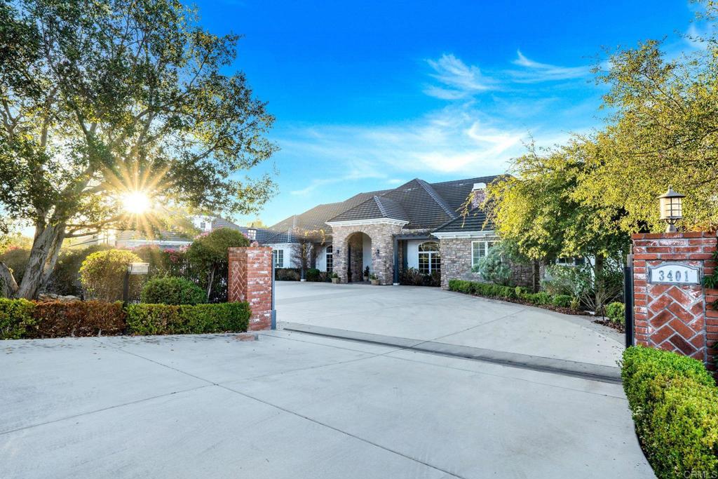 Retreat to this ultra-exclusive enclave of just six estates, this extraordinary single level 6-bedroom, 4.5-bathroom residence is a rare fusion of luxury, privacy, and refined living so secluded, it feels as if you own the entire community. From the moment you step inside, you are greeted by soaring 11-14 ft ceilings and a grand, open-concept design that radiates sophistication. Designed for both lavish entertaining and effortless daily living, this estate features a kitchen that is a masterpiece of style and functionality. Featuring top-of-the-line appliances, custom cabinetry, a walk in pantry, and exquisite countertops, this space is as beautiful as it is practical. Natural light floods the room, highlighting the high-end finishes and seamless flow into the open living areas. Whether you're hosting a lavish dinner party or preparing a quiet family meal, this kitchen is the heart of the home. The resort-style backyard, complete with a breathtaking infinity pool, a rejuvenating jacuzzi, and steel security fencing for ultimate peace of mind. An outdoor fireplace and seating area are great for entertaining. There is so much additional space with this home sitting on over 2 acres of usable space, For the equestrian lovers, there are 2 12’x24’ partially covered stalls with a large, shaded turnout. Small fenced area in the turnout is for a dumpster for manure, etc. The playhouse doubled as a tack room/feed storage. There is also a tall flood light down below to offer extra lighting for horses or for playing/entertaining on the lawn. There is plenty of room to host a wedding on the lawn as well. The VIEWS from this estate are unmatched and photos do not do it justice, come take a look for yourself! The expansive 3-car garage provides ample space, an EV charger, and additional storage. For those who appreciate nature’s bounty and a self-sustaining lifestyle, this estate offers an unparalleled farm-to-table experience. Lush citrus and avocado trees, a flourishing vegetable garden, and equestrian stables provide an exquisite blend of rustic charm and modern luxury. With only one meticulous owner since its construction, this estate has been impeccably maintained, offering a once-in-a-lifetime opportunity to own a private sanctuary that seamlessly balances elegance, exclusivity, and sustainability. Experience the pinnacle of luxury living, schedule your private tour today!