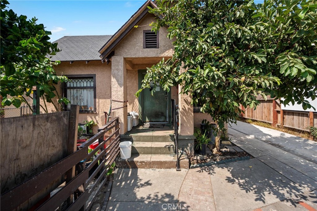 Discover this exceptional 2-unit income property perfectly situated in the vibrant heart of Los Angeles, California. Each spacious unit features 2 bedrooms and 1 bathroom, along with a convenient separate laundry room. The residences boast generous living and dining areas, ideal for comfortable living and entertaining. Both units are completely separate, offering privacy and versatility, with a charming yard space in between for outdoor enjoyment. A detached garage provides ample parking for over 6 cars, making parking stress-free for residents and guests alike. Located just a few miles from USC, the Convention Center, Crypto Center, and the bustling Downtown LA shops, restaurants, and transportation hubs, this property offers unmatched convenience and potential. Both units will be delivered vacant, ready for immediate occupancy or rental or redevelopment. Don't miss this fantastic investment opportunity in a prime LA location!