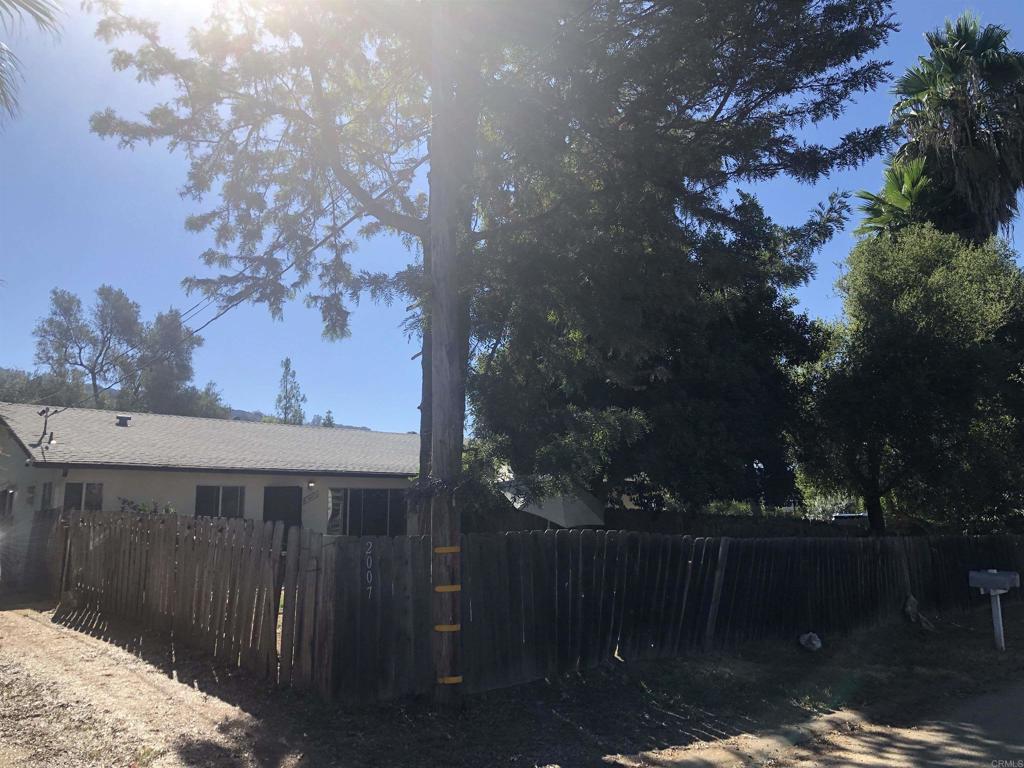 OPPORTUNITY HAS ARRIVED! Quaint Duplex is Rural Fallbrook Community of Rainbow, CA. Both Units are Tenant Occupied to Provide Immediate Rental Income or Live in One and Rent the Other for More Opportunity to Enjoy Rental Income and Your Very Own Slice of County Peace. Each Unit has Fenced Front Yards and the North Unit has a Large Fenced Back Yard. South Unit has Access to the Remaining Section of the Large Flat Lot with Various Fruit and Citrus Trees Bordering the Property. Two Out Buildings Provide Storage and a Rustic County Feel. Each Unit is a 2 Bedroom, 1 Bathroom, Approximately 960 Sq Ft Situated on a 0.59 Acre Parcel Serviced by an Advanced Treatment Septic System. Come Visit and You Will Want to Make this Special Slice of Rainbow your Pot of Gold.
