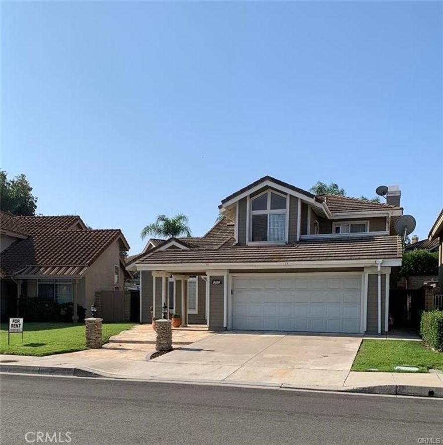 Great two story home with vaulted celling in living room. Formal dining room. Open kitchen with daily dining area. 1 bedroom and One bath downstairs. Master suite with walk-in closet. Master bathroom has dual wash basins and separate tub and shower. Two of the bedrooms up stairs share balcony. Back yard with cover patio and fruit tree, Walking distance to school and park.
