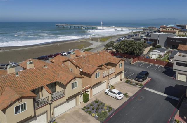 This Fabulously remodeled Townhouse is your opportunity to live just steps from the beach! Ocean views from the large Patio, Family Room and Primary Bedroom allow you to relax while feeling like you're on vacation. Enjoy the beautiful gourmet kitchen with stainless steel appliances and quartz countertops. Gorgeous walnut flooring throughout, custom light fixtures, and dual-pane windows with custom window coverings. Ideally located within close proximity to shops, restaurants and just minutes away from SFO, BART and Highway 280. For golfers, this home is also near Sharp Park Golf Course. The three-bedroom, two and one-half bath townhome, with 2-car garage and washer & dryer has everything you've been looking for. Welcome home!