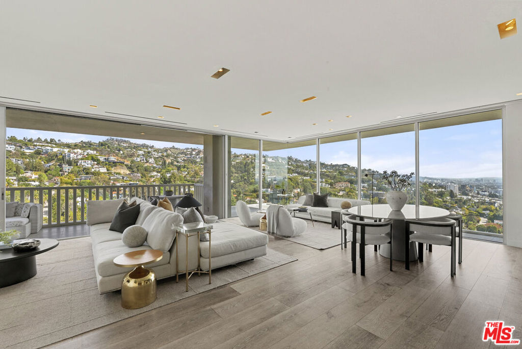 Discover luxury high-rise living in one of Los Angeles' most architecturally significant and iconic addresses--Sierra Towers. This coveted corner unit offers sweeping views from Greystone Mansion to Downtown LA and features an airy, light-filled layout with floor-to-ceiling windows and custom finishes throughout. Elegantly updated, the turnkey interiors include stone countertops, light cabinetry, and warm wood flooring. The open-concept kitchen flows seamlessly into a spacious living area, thoughtfully designed with a hidden Murphy bed for added flexibility. Originally a two-bedroom, the unit can be reconverted to suit your lifestylewhether as a second bedroom or home office. The enlarged primary suite includes a generous walk-in closet, while a private terrace stretches the length of the residence--ideal for enjoying LA's skyline. Residents of Sierra Towers enjoy premier services and amenities, including 24/7 concierge and security, valet parking, an on-site management team, and a state-of-the-art fitness center with pilates studio. Relax in the saltwater pool, spa, or sauna--all within a community known for its discretion and long standing celebrity cachet. Ideally located just moments from the city's finest dining, shopping, and entertainment--including Soho House, San Vicente Bungalows, the Beverly Hills Hotel, and Rodeo Drive.