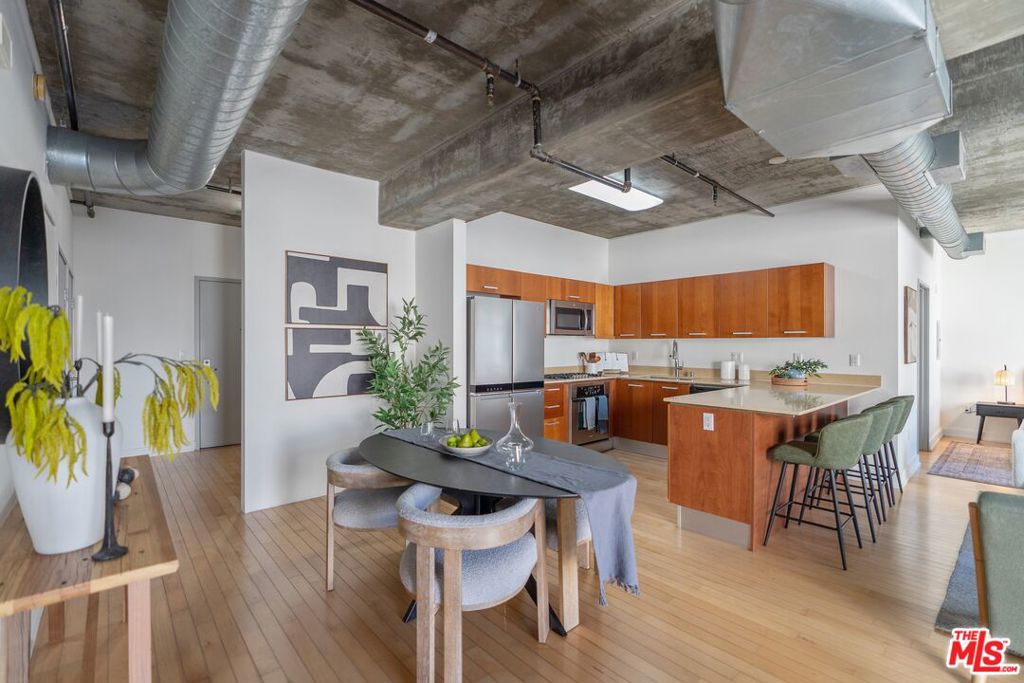 Experience the best of Downtown LA South Park living in this stunning 2 bed, 2 bath condo at Market Lofts! This industrial loft features an open-concept layout (no dividing bedroom walls) and a spacious balcony overlooking a serene courtyard. It's a corner unit with no shared walls for ultimate privacy. The primary bedroom boasts a huge walk-in closet, while the secondary bedroom also offers a walk-in-closet, providing ample storage space. Both bathrooms feature full bathtubs with showers for ultimate comfort. Enjoy modern conveniences with central AC/heat (replaced in 2023), in-unit combo washer/dryer, and a fully-equipped open kitchen with a refrigerator, oven, microwave, and more. Market Lofts offers unbeatable amenities, including a theater room, fitness center, pool, spa, BBQ area, and secured garage parking. With 24/7 front desk service, security, and on-site management, convenience and peace of mind come standard. Located in a prime spot near Whole Foods, Pershing Square, Crypto Arena, LA Live, The Bloc, The Metro, and an array of top restaurants and vibrant shops. Ralph's is conveniently attached to the building.