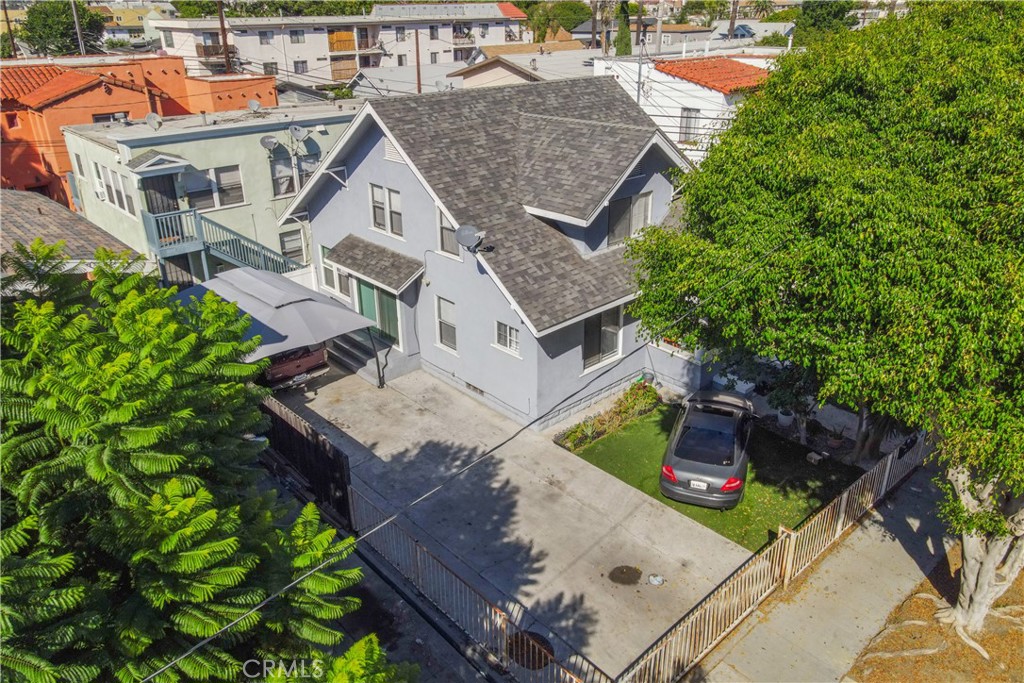 High income totally updated 4 unit property in Downtown Long Beach with a 4 bed, 2.5 bath front house full of character plus three 1 bed, 1 bath units in the rear. All units recently updated, newer roof, replaced stairs, landscaping and exterior refresh completed. Very well priced on income at 11.3X GRM on actuals and a 5.7% cap rate with upside to 10.7X GRM and a 6.1% cap rate on market rents. 2 garages in rear structure plus driveway parking for 3 cars by the front house. Potential for ADU conversion in rear garages. Separately metered for gas and electric, allowing a low expense building. Great location right in Downtown Long Beach just North of the East Village Arts District. Blocks away from St. Mary's hospital, Museum of Latin American Art, rail lines, and $8 billion of new development. Only 8 blocks to the beach.