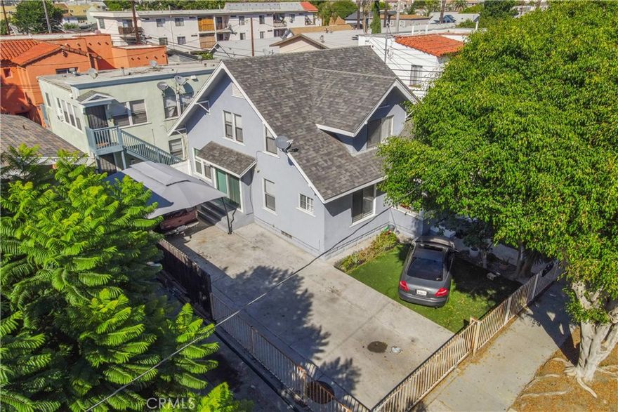High income totally updated 4 unit property in Downtown Long Beach with a 4 bed, 2.5 bath front house full of character plus three 1 bed, 1 bath units in the rear.  All units recently updated, newer roof, replaced stairs, landscaping and exterior refresh completed.  Very well priced on income at 11.3X GRM on actuals and a 5.7% cap rate with upside to 10.7X GRM and a 6.1% cap rate on market rents.  2 garages in rear structure plus driveway parking for 3 cars by the front house.  Potential for ADU conversion in rear garages.  Separately metered for gas and electric, allowing a low expense building.  Great location right in Downtown Long Beach just North of the East Village Arts District.  Blocks away from St. Mary's hospital, Museum of Latin American Art, rail lines, and $8 billion of new development. Only 8 blocks to the beach.