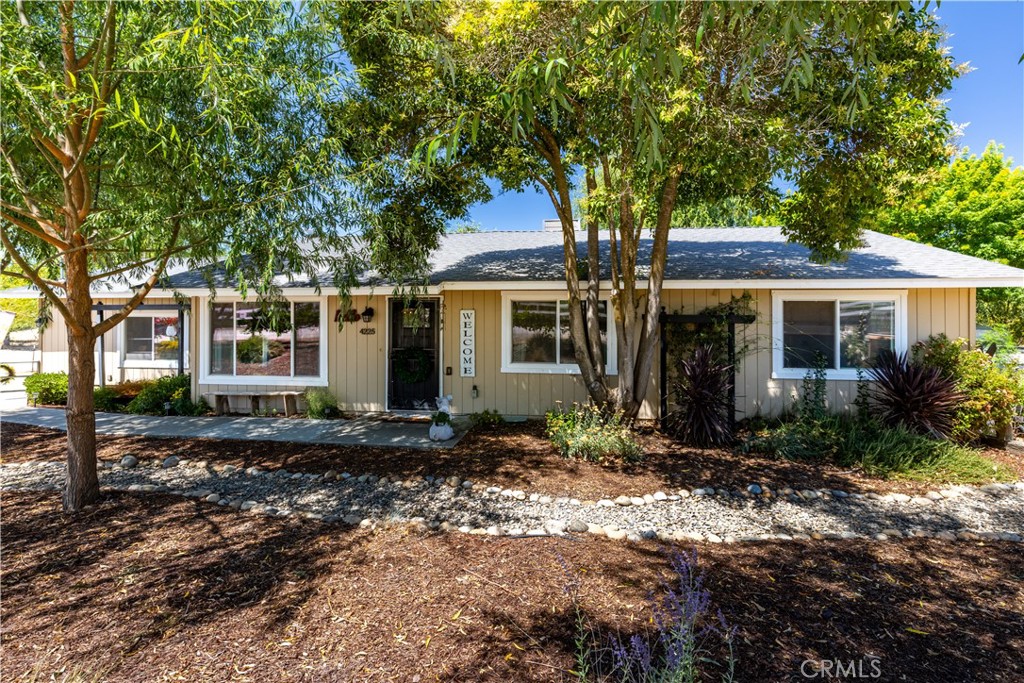 Welcome to this charming single-level farmhouse nestled on approximately 2 acres of fully usable land - thoughtfully set up for horses, livestock, and relaxed country living. This 3-bedroom, 2-bath home offers about 1,350 square feet of comfortable living space and a beautiful blend of rustic charm and modern upgrades, with a full renovation completed around 2018. Those improvements included a new roof, composite decking, granite countertops, dual-pane vinyl windows, stainless steel appliances, and upgraded flooring - featuring laminate and tile throughout most of the home, with plush carpeting in the bedrooms for added comfort. Step into the warm and inviting living room, where high wood ceilings and large windows create an open, airy atmosphere. The kitchen is well-appointed with granite counters and stainless appliances and flows easily into the dining room, which features a sliding glass door that opens to the backyard and covered back patio - ideal for entertaining or enjoying indoor-outdoor living. The primary suite includes a private bathroom with granite countertops and updated finishes, while the guest bathroom features dual sinks and serves the two additional bedrooms conveniently located off the hallway. Outside, the property is a dream for animal lovers and hobby farmers alike. It is fully fenced with two gated entrances, mature landscaping, and a tranquil koi pond with a waterfall. A well-established garden and multiple fruit trees - including apricot, peach, plum, nectarine, Granny Smith apple, and mulberry - enhance the rural lifestyle. Equestrian amenities include a ~32' x 40' barn, mare motel, sanded round pen with a 12' x 20' covered area, tack room, chicken coop, and multiple horse stalls and dog kennels. Additional improvements include an 18' x 20' shop on decomposed granite with an 8' roll-up door, an 800-foot well, and 24 solar panels for energy efficiency. Currently used as an animal rescue, this special property offers unmatched versatility, charm, and function. All this, tucked in a rural setting just minutes from Highway 101, renowned wineries, local shops, and more - making it the perfect blend of peaceful country living and everyday convenience.