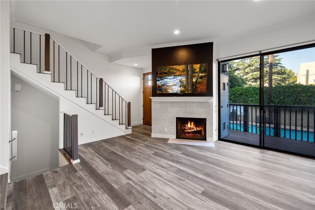 Move in and enjoy one of the hottest LA neighborhoods before summer ends! Tremendous opportunity to live in and invest on this contemporary NoHo Arts District Townhome with Designer Upgrades & Dream Location, borderline Toluca Lake.
Welcome to the heart of the vibrant North Hollywood Arts District, where style, convenience, and comfort converge. This modern 2-bedroom, 2.5-bathroom townhome with a flexible bonus room that has been used as a third bedroom in the past offers a rare blend of upscale living and urban accessibility. Just steps from trendy restaurants, theaters, nightlife, and the Metro Red Line, with Universal Studios, Burbank, and Toluca Lake minutes away. Inside, you'll find vaulted ceilings, newer flooring throughout, and an open multi-level floor plan filled with natural light. The living room features dramatic high ceilings, recessed lighting, and a striking Carrera marble fireplace with the included 65” Sony TV mounted above, with direct access to a private balcony. The kitchen is equipped with stainless steel appliances—including a new range and wine fridge—stone countertops, grey subway tile backsplash, and abundant cabinetry. A cozy breakfast nook adds charm and function.
Retreat upstairs to the stunning primary suite, complete with a newly renovated spa-like bathroom (2025), a custom walk-in closet, vaulted ceilings, and a second private balcony. The second bedroom also features an en-suite bathroom and a spacious closet with built-in shelving and drawers—perfect for guests or a stylish home office. A skylight on the upstairs landing fills the space with natural light.
The lower-level bonus room offers incredible flexibility and can be used as a bedroom, office, den, or creative studio, with direct access from the attached 2-car garage.
Additional features include:
• Brand new HVAC system (2024) with Nest smart thermostat
• Two private balconies
• In-unit laundry
• Attached 2-car garage with direct access
• Tons of built-in storage throughout
• Access to community pool & sp.
This move-in-ready townhome offers the ideal blend of luxury and location, the HOA covers water, earthquake insurance, pool, jacuzzi, landscaping, some general building maintenance.
Don’t miss your chance to own a home that truly has it all in one of LA’s most walkable and exciting neighborhoods. The seller is very motivated.