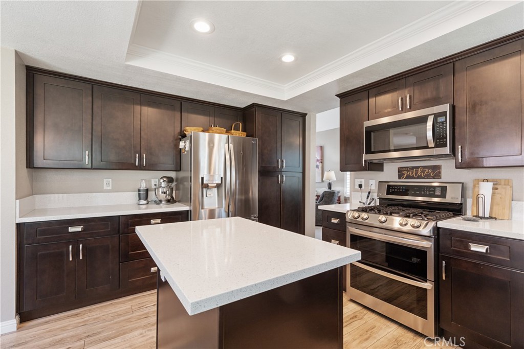 This beautifully updated home is located in the desirable North La Verne Live Oak community with UPDATES GALORE! Located in a cul-de-sac and close to scenic hiking and nature trails, this property offers a wonderful blend of comfort, style, and convenience. Residents enjoy access to a beautiful community pool and spa, RV and boat storage, and ample guest parking. Step into a thoughtfully upgraded interior featuring a remodeled kitchen and bathrooms, updated flooring, dual-pane windows, and a stylish modern fireplace. The freshly painted exterior, updated banister, and newer finishes throughout add to the home’s charm and move-in ready appeal. The backyard is a true highlight—private and peaceful, with lush greenery and vibrant flowers lining the back wall. Whether enjoying a quiet morning coffee or hosting an evening BBQ, this space is perfect for entertaining and unwinding. Additional features include driveway parking and a spacious 3-car garage. Don’t miss the opportunity to own this inviting, well-cared-for home in this desirable neighborhood of North La Verne.