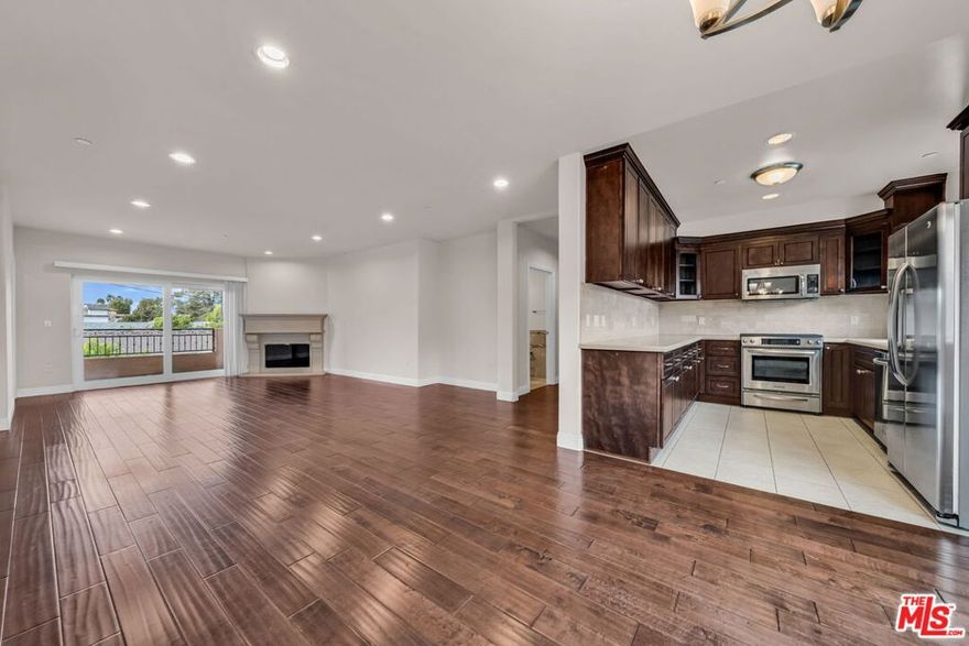 Large & bright updated contemporary single story 1,550 square foot 3bed 2.5 bath apartment in a small eight unit building with NO common walls and only two units on each floor. Open flowing living room with a fireplace and a spacious balcony. Updated kitchen off the living room with stainless steel appliances. Primary bedroom has a large bathroom with a separate tub & shower, as well as a walk-in closet.  2nd hallway bathroom has a tub/shower. 2nd & 3rd bedrooms have lots of light. In-unit washer & dryer, central AC and two assigned parking spots in a gated garage. Pet Friendly