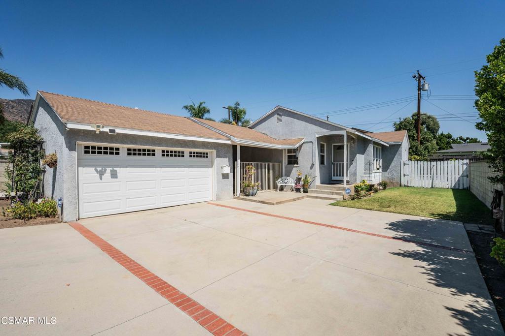 Welcome to this delightful single story home nestled in the heart of Glendora, offering comfort, charm, and peaceful mountain views. This 3 bedroom, 1 bathroom residence features 1,056 sq. ft. of comfortable living space on a 5,045 sq. ft. lot. From the moment you arrive, you'll appreciate the spacious driveway, 2-car garage, and the inviting curb appeal. A covered breezeway with a ceiling fan creates the perfect spot for outdoor relaxation, entertaining guests, or enjoying weekend BBQs. Inside, the home boasts warm wood flooring, smooth ceilings, and dual-pane windows that fill the space with natural light. The updated kitchen is both functional and stylish, featuring granite countertops, ample cabinet space, and tile flooring--ideal for cooking and entertaining. The living room offers a cozy ambiance with built-in bench/window seating, seamlessly connecting to a bright dining area. All three bedrooms are comfortably sized, and the indoor laundry room adds convenience to daily living. Central air and heat ensure year-round comfort. Step outside to a private backyard complete with a lush grass area and a mature fruit tree--perfect for kids, pets, or gardening enthusiasts. Located close to schools, shopping, dining, Citrus College and Azusa Pacific University and more, this home combines tranquility with everyday convenience. Don't miss your chance to own this Glendora gem!