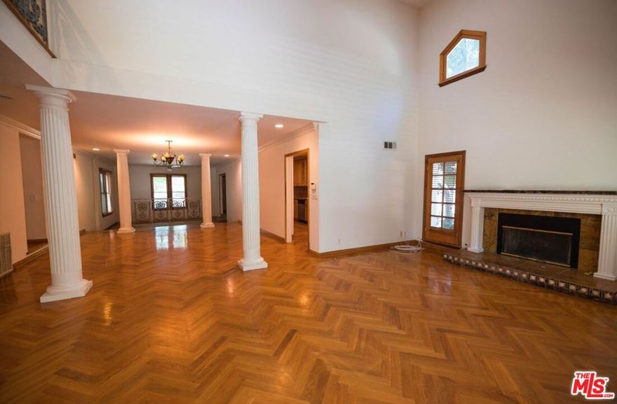 Dramatic Designer Custom Built County English Home with OVER 20 FOOT HIGH CEILINGS WHEN YOU ENTER.  QUITE AN AMAZING ESTATE.  DINING AREA EMBELLISHED WITH FLUTED PILLARS SURROUNDING A MULTI-COLORED CHANDELIER lighting a Large Dining Area big enough for Holiday Parties, AND WITH SO MUCH MORE TO OFFER! TWO-STORY COUNTRY ENGLISH ON A LARGE CORNER LOT LOCATED IN PRIME "GARFIELD HEIGHTS" PASADENA, CA. EXQUISITE MARBLE MANTLED FIREPLACE IN THE SPACIOUS LIVING ROOM, 4 HUGE FLOOR TO CEILING FLUTED COLUMNS SURROUND THE LARGE DINING AREA, PERFECT FOR ABUNDANT ENTERTAINING! CUSTOM ITALIAN TILED KITCHEN WITH MAPLE WOOD CABINETS, SIMPLY STRIKING CUSTOM HERRINGBONE HARDWOOD FLOORS. 3 LARGE BEDROOMS 3 SPACIOUS BATHROOMS. TWO BEDROOMS AND TWO BATHROOMS ON THE FIRST FLOOR. A BREATHTAKING MASTER SUITE IS THE ENTIRE 2ND FLOOR WITH A SPA TUB PLUS A SEPARATE HUGE MARBLE SHOWER PLUS HIS + HERS WALK-IN CLOSETS WITH EVEN MORE DEEP-STORAGE FOR WINTER CLOTHES AND SUMMER CLOTHES!  FEATURES INCLUDE A CUSTOM STEP DOWN DEEPLY PLUSH-CARPETED LARGE FAMILY ROOM, A LARGE SUNNY REDWOOD DECK UNDER THE TREES AND OVERLOOKING THE GROUNDS, PERFECT FOR OUTDOOR DINING! CENTRAL AIR & HEAT PLUS 4 CAR PARKING: 2 CAR DETACHED GARAGE, WITH AMPLE PARKING FOR 2 MORE CARS! PLUS A BASEMENT, AND THE BEAUTIFUL FEATURES CONTINUE ONWARD!!  PLEASE NOTE THAT RENTAL APPLICATIONS ARE NON-REFUNDABLE.