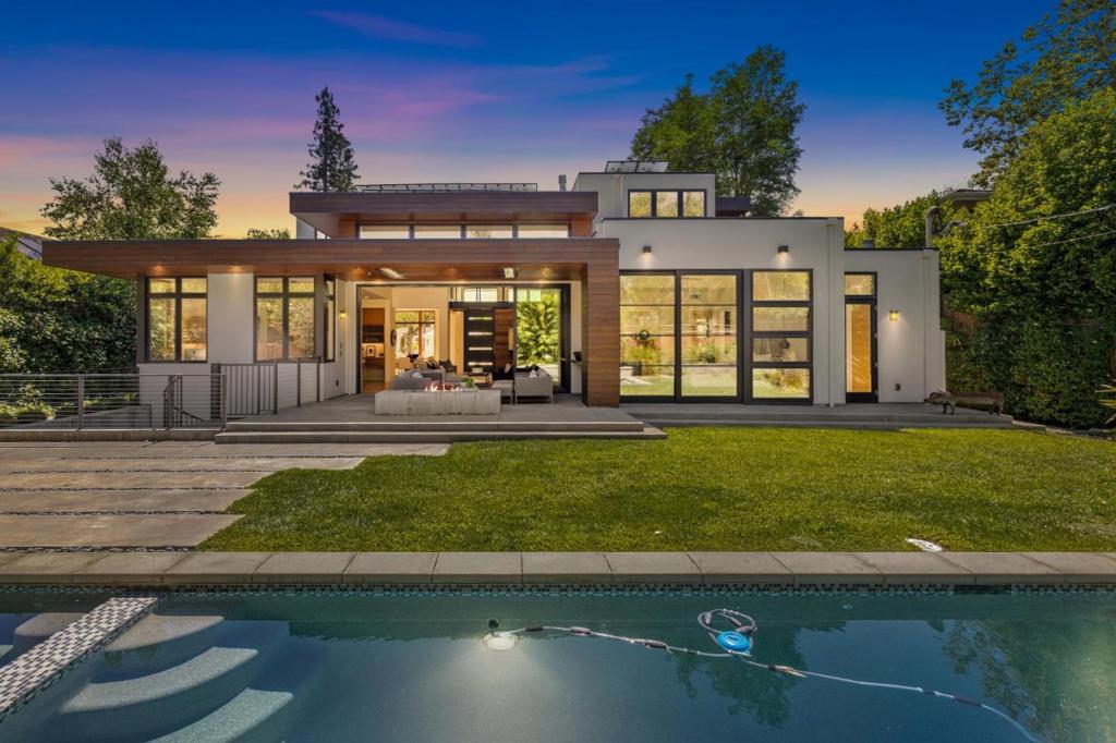 In the heart of old Palo Alto sits, this contemporary masterpiece. Offering six bedrooms and six bathrooms, this 5,063 s/f home, spares no expense in the quality and design. The lower level has a wet bar, home, theater system, wine cellar and en suite bedroom and office/bedroom, as well as the workout area and an outer deck with a spiral staircase up to the pool in the backyard. The indoor outdoor design is seamless and seamless. With three bedrooms upstairs and the primary suite on the main floor, the floor plan provides maximum privacy and comfort. The chefs kitchen is outstanding, with sit down bar and Island, a breakfast nook and walk in pantry. Built by Mason Hammer Builders and designed by Steve Simpson Design Group. Sustainable landscaping surrounds the home and is water-efficient.