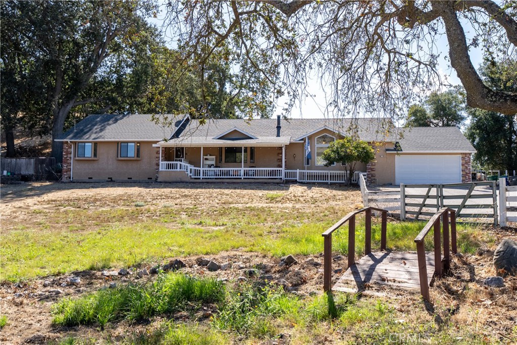 Welcome to this exceptional 2712 sf residence nestled on 2.49 acres at the northern end of Atascadero. With 3 bedrooms, 3 bathrooms and thoughtfully designed living spaces, this property offers the perfect blend of comfort, functionality and versatility. Step inside to a bright front living room featuring vaulted ceilings, a wood-burning stove with a charming brick surround and a large bay window that fills the space with natural light. The open kitchen and dining area provide plenty of room for everyday living or entertaining, offering ample cabinetry, generous counter space and a convenient center island. Adjacent to the kitchen is a spacious bonus room—ideal for a family room, game room, home gym or hobby space. The outdoor living areas are truly special, designed to maximize enjoyment of the Central Coast lifestyle. A covered pergola, composite deck perfect for al fresco dining, trellis-covered patio and turf lawn create a low-maintenance, inviting backyard retreat. Behind the home, you’ll find a ~600 sq. ft. workshop complete with a roll-up door, workbench, lighting and power—perfect for projects, storage or creative pursuits. At the back of the property is a large open area, ideal for animals, 4H projects or future expansion, including a potential ADU building site (buyer to verify with the City of Atascadero). The front of the property features an additional fenced pasture, a gated entry and an expansive driveway that easily accommodates multiple vehicles, including RVs, trailers and boats. Conveniently located with easy freeway access, this property offers a peaceful country setting while keeping you close to everything the Central Coast has to offer. Don’t miss the opportunity to make this versatile property your own—whether you’re looking for space to grow, create, or simply enjoy the outdoors. Please review the Virtual Tour for additional information.