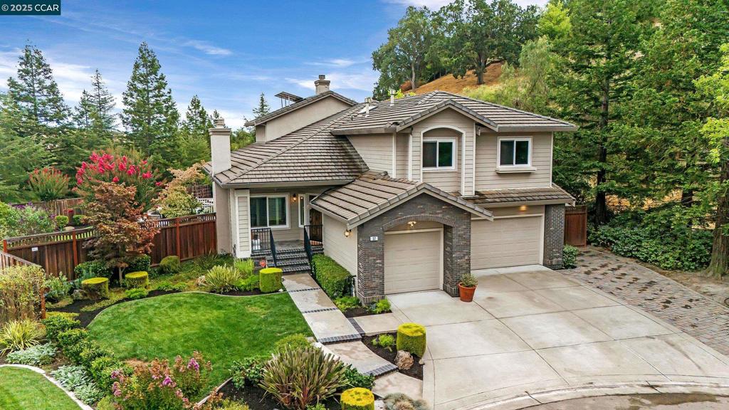 Welcome to this stunning Shadow Creek home, ideally located at the end of a cul-de-sac and serene open space to the side and behind. The split-level layout offers soaring ceilings in the formal living and dining rooms, creating an airy, light-filled entry. The updated kitchen features quartz countertops, a spacious pantry, breakfast nook, and overlooks the inviting family room. A full bedroom and bath on the lower level provide the perfect retreat for guests or in-laws. Easy access from the three car garage to the lower level, entering through the laundry room. Upstairs, the expansive primary suite includes a fireplace, dual closets, a soaking tub, stall shower, double vanity, and a bonus study ideal for a home office. Two additional, generously sized bedrooms share a beautifully updated hall bath. The backyard is designed for entertaining with a sparkling Pebble Tec pool, fire pit, large deck, and generous artificial turf side yard. With exceptional indoor-outdoor flow and a prime Danville location, this home is a rare find.