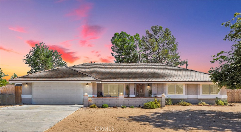 This stunning 3-bedroom, 2-bathroom home offers 1,940 sq ft of upgraded living space on a spacious 0.688-acre lot. Located in one of Apple Valley’s most sought-after neighborhoods, this home welcomes you with a charming front porch and an open floor concept as you enter. Enjoy updated flooring throughout, a beautifully remodeled kitchen featuring gold hardware, modern countertops, and a stylish backsplash. The home also features newer windows, ceiling fans throughout, and extra hallway storage for added convenience. The spacious primary suite includes a luxurious soaking tub and walk-in shower combo. Step outside to a fully fenced, private backyard, with a large covered patio and above ground pool Perfect for entertaining or relaxing in peace. This move-in-ready home combines style, comfort, and location—don't miss out!