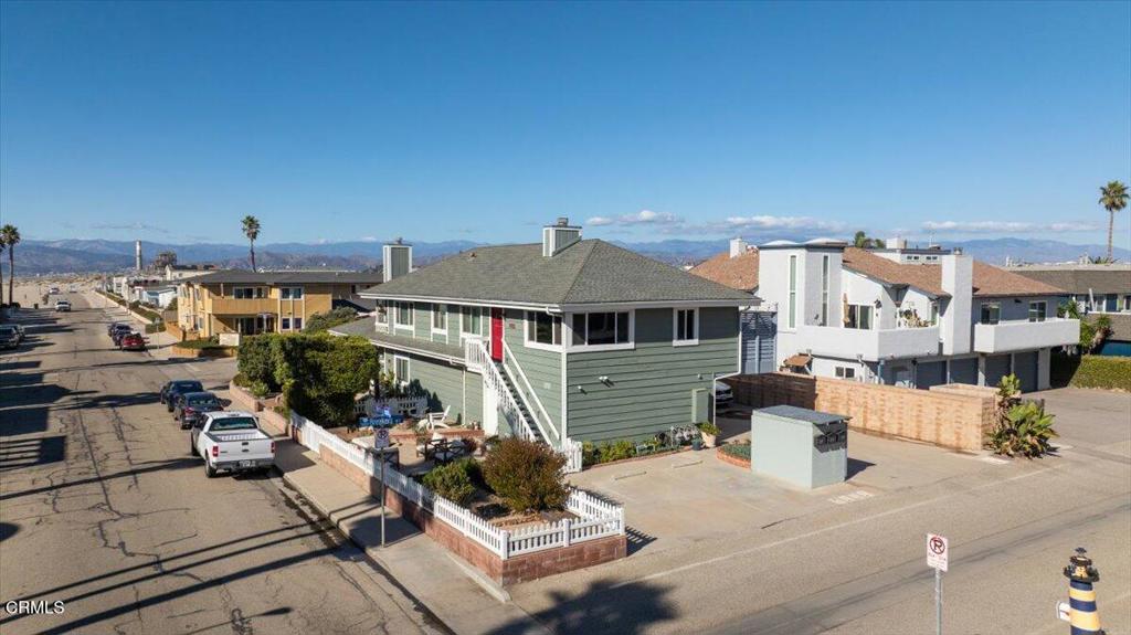 Coastal Comfort Meets California Charm -- Just steps from the sand, this beautifully updated 2-bedroom, 2-bath one-of-a-kind condo in Oxnard Shores offers the perfect blend of beachside serenity and modern convenience. Enjoy peek-a-boo ocean views from the living room and bedroom, vaulted wood-beam ceilings throughout, and a cozy fireplace that anchors the inviting living space. Both bathrooms have been remodeled with skylights that fill the rooms with natural light, and the chef's kitchen shines with newer cabinetry, stainless appliances, and a striking copper sink. The primary suite features a walk-in closet and serene ambiance, perfect for unwinding after a day at the beach. Entertain with ease on the dining deck or in one of two spacious patios--complete with a fire pit, garden area, and a fenced-in space ideal for pets.Additional highlights include a 2-car garage with washer, dryer and EV charger, plus a dedicated parking space for guests or extra vehicles. Dual-pane windows and a low HOA add comfort and value. Nestled between Malibu and Santa Barbara, this move-in-ready gem delivers coastal living at its finest--complete with ocean views from your front door