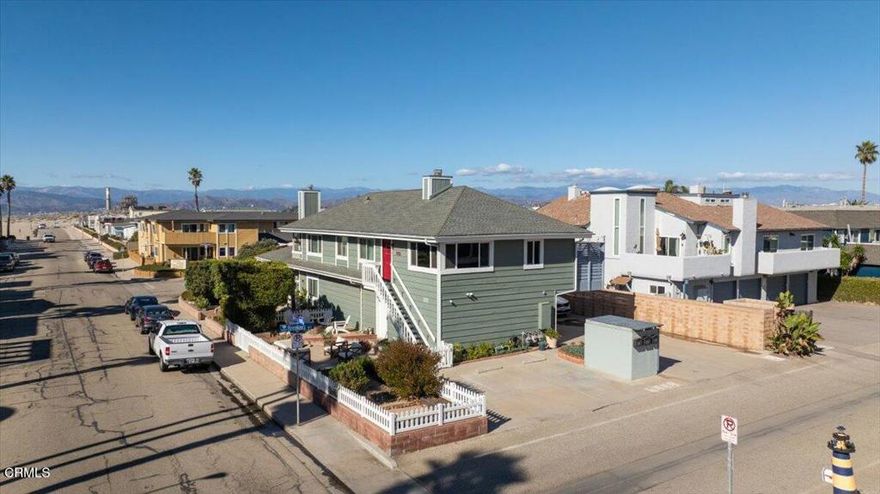 Coastal Comfort Meets California Charm -- Just steps from the sand, this beautifully updated 2-bedroom, 2-bath one-of-a-kind condo in Oxnard Shores offers the perfect blend of beachside serenity and modern convenience. Enjoy peek-a-boo ocean views from the living room and bedroom, vaulted wood-beam ceilings throughout, and a cozy fireplace that anchors the inviting living space. Both bathrooms have been remodeled with skylights that fill the rooms with natural light, and the chef's kitchen shines with newer cabinetry, stainless appliances, and a striking copper sink. The primary suite features a walk-in closet and serene ambiance, perfect for unwinding after a day at the beach. Entertain with ease on the dining deck or in one of two spacious patios--complete with a fire pit, garden area, and a fenced-in space ideal for pets.Additional highlights include a 2-car garage with washer, dryer and EV charger, plus a dedicated parking space for guests or extra vehicles. Dual-pane windows and a low HOA add comfort and value. Nestled between Malibu and Santa Barbara, this move-in-ready gem delivers coastal living at its finest--complete with ocean views from your front door