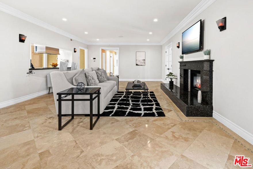 This gated, move in ready, retreat in Beverly Crest Hills combines luxury and convenience, having been renovated late 2023. It features a welcoming motor court and an open floor plan filled with natural light. The main floor offers a formal dining room with a fireplace and a nice courtyard for outdoor dining. Upstairs, the spacious primary suite includes its own fireplace, a luxurious bathroom, and a large walk-in closet. Additional bedrooms provide access to a multi-level outdoor space ideal for entertaining, and the property includes an attached guest apartment suite. This home is a serene escape, conveniently located near downtown Beverly Hills, the Glen Center, major studios, and top-rated schools.