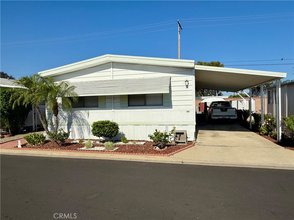 Welcome to this beautifully maintained and upgraded 2-bedroom, 2-bathroom mobile home located in the highly sought-after Kingsway Gardens Estates in the city of La Verne. Offering just under 1,100 sq ft of comfortable living space, this home is perfect for those seeking a move-in ready property in a peaceful and well-located community.
Step inside to discover a light-filled open floor plan, featuring a remodeled kitchen with updated countertops, modern cabinetry, and newer appliances. Upgrades continue throughout the home with newer flooring, fresh paint, and updated fixtures that give the space a fresh, contemporary feel.
The primary bedroom is spacious and includes ample closet space along with a private en-suite bathroom. A second full bathroom and generously sized second bedroom make this home perfect for guests, family, or a home office setup.
Enjoy relaxing on the covered front porch, ideal for outdoor dining or morning coffee. The property also includes a 2-car covered carport, storage shed, and low-maintenance landscaping.
Located near the Fairplex, freeways, and public transportation, this home offers convenience and connectivity