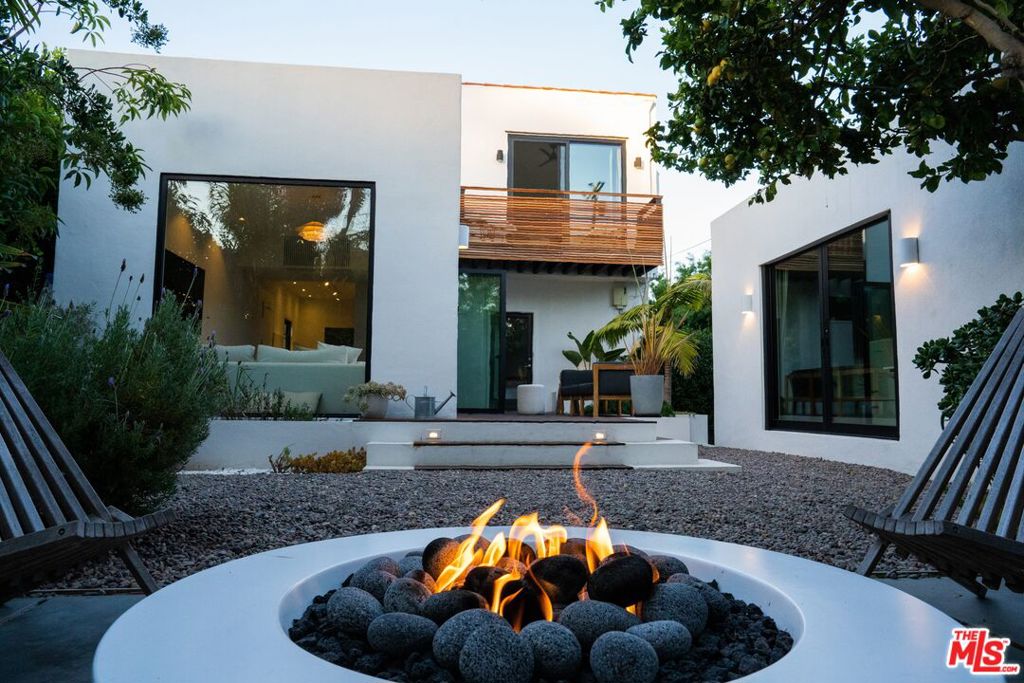 Welcome to your Spanish-style oasis nestled near the vibrant Rose Avenue in the heart of Venice Beach, California. This exquisite residence boasts a perfect blend of timeless elegance and modern comfort, offering a lifestyle of sophistication and relaxation. Step into this charming 2-bedroom, 3-bathroom home where every detail showcases meticulous craftsmanship and thoughtful design. The vibrant Spanish architecture invites you into a world of warmth and character. The interior seamlessly merges with the outdoors, creating an entertainer's dream. As you step outside, discover the allure of the beautiful backyard retreat. Lush greenery surrounds a tranquil oasis, complete with a rejuvenating hot tub, making it the ideal setting for al fresco gatherings and moments of serene relaxation under the California sun. The spacious interior living areas are adorned with natural light, creating an inviting ambiance for both daily living and hosting guests. The gourmet kitchen, a culinary masterpiece, features top-of-the-line appliances and artisanal finishes, catering to the needs of the discerning chef. Retreat to the expansive upstairs master suite, a private sanctuary offering a haven of comfort and luxury. The additional well-appointed bedroom provide ample space for family, guests, Plus there is a detached dedicated flex space. Located mere moments from the eclectic energy of Rose Avenue, this residence provides convenient access to the renowned dining, shopping, and cultural experiences that Venice Beach has to offer. Whether strolling along the iconic boardwalk or enjoying the vibrant local scene, this home offers the quintessential Venice Beach lifestyle. Immerse yourself in the unparalleled charm and allure of this gem, where every detail has been carefully curated for a life of comfort, luxury, and effortless entertainment.
