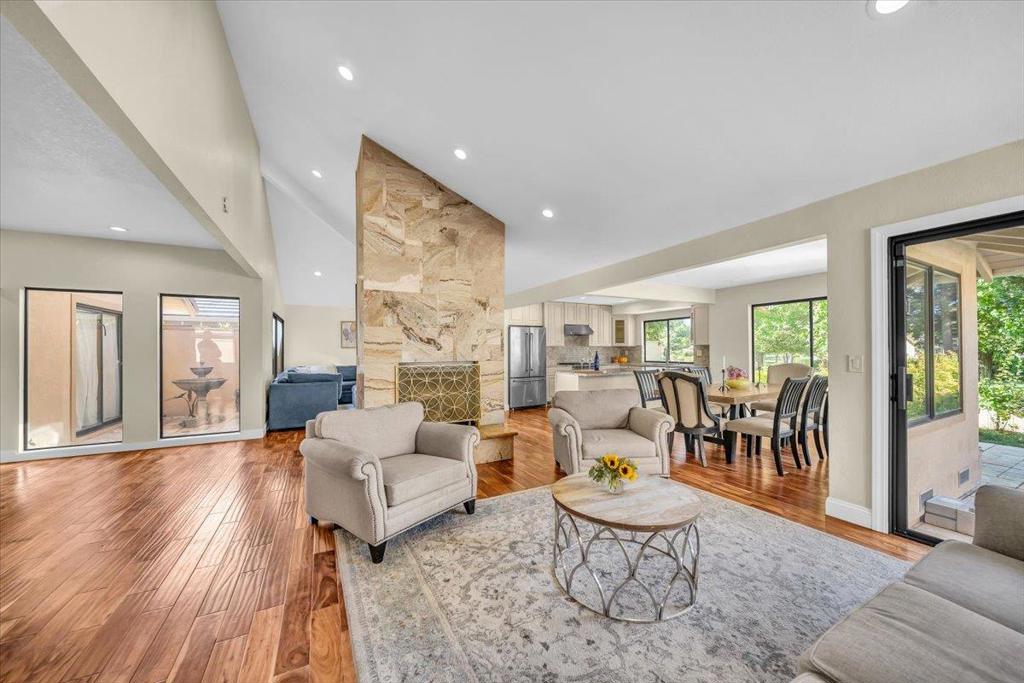 Set in the desirable Meadows Community of Corral de Tierra, this beautifully updated single-level home offers both comfort and elegance in a serene setting. The residence features a bright, open floor plan with vaulted ceilings and expansive windows that frame views of the surrounding greenery. The spacious living area is anchored by a striking stone fireplace and flows seamlessly into the dining space and remodeled kitchen, complete with granite counters, custom cabinetry, and premium stainless-steel appliances. With multiple access points to the outdoors, the home is designed for easy indoor-outdoor living. A private courtyard welcomes guests at the entry, while the rear patio is perfect for al fresco dining, entertaining, or simply relaxing under the Corral de Tierra sun. The bedrooms are generously sized, while the bathrooms feature stone finishes, dual vanities, and a spa-like shower and soaking tub. Nestled in a peaceful neighborhood yet conveniently located near Highway 68, golf courses, and just a short drive to Monterey or Salinas, this home offers the best of both worlds: a tranquil retreat with access to all the Central Coast has to offer.