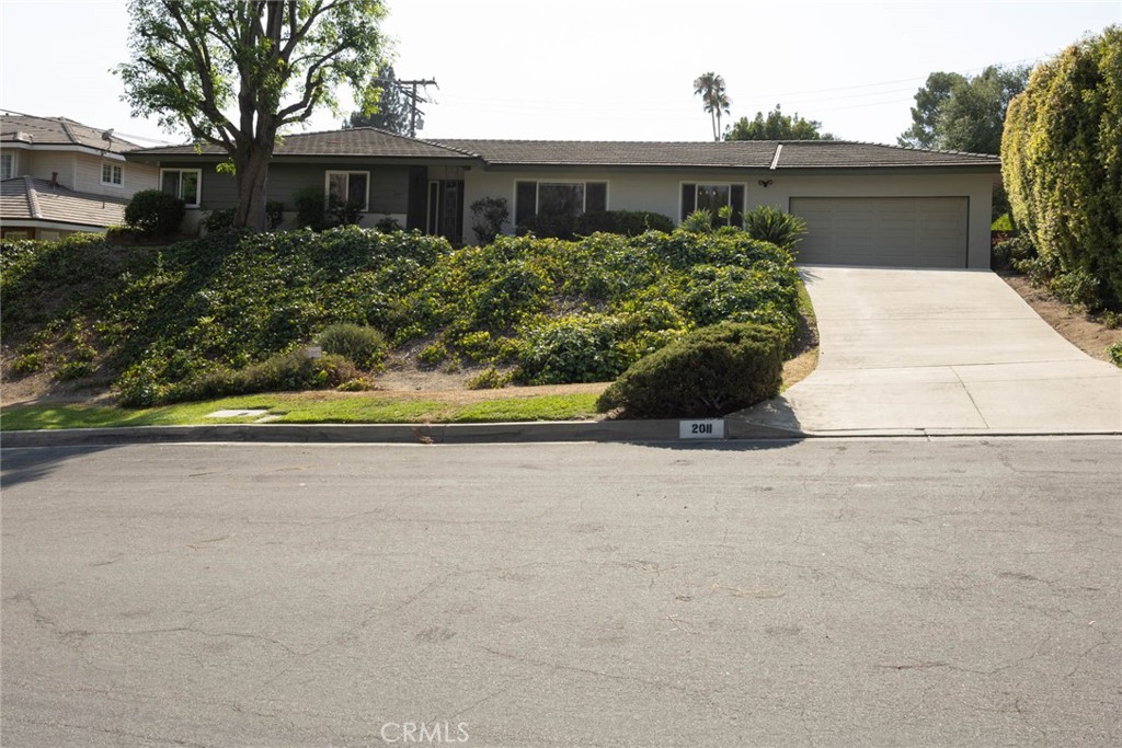 Situated in the prestigious Highland community of North Arcadia, located in the award-winning Arcadia Unified School District, close to Highland Oaks Elementary, Foothills Middle School, This beautiful newly painted, one story residence nearly 000 SQFT. It has 2 bedroom suites and 2 guest bedrooms, plus 3 and ½ baths. Primary bath has Jacuzzi tub and a walk-in shower. Spacious living room comes with formal dining area, Huge family room comes with a fireplace. Big bonus room over look beautiful blue swimming pool from two big windows. Updated kitchen has all modern appliances, also has a cozy breakfast area.
Family room, bonus room, and guest suite are all covered with wood panels from wall to wall. Well maintained original hard wood floor throughout most of living spaces.
Back courtyard has plenty of fruit trees, garden, and swimming pool, great for BBQ and family entertaining.
Facing South this house is also equipped with energy features, including paid solar system, dual water heaters, all double pane windows, ceiling fans, insulated garage door panels, and powered circular ventilation.
You don’t want to miss this property only second time on the market since 1956.