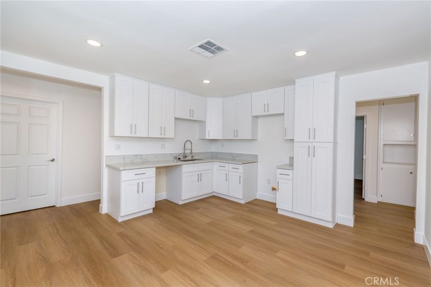 Remodeled single-story home offering 3 bedrooms and 2 bathrooms across 1,664 sq ft of living space on a 6,763 sq ft lot in Canoga Park. This move-in-ready property features all-new plumbing, updated electrical, a new roof, a new HVAC system, fresh interior and exterior paint, and vinyl flooring throughout. The kitchen and bathrooms have also been remodeled. The home includes two separate garages, potential for an ADU or providing ample parking and storage. Conveniently located near schools, parks, shopping, and public transportation.