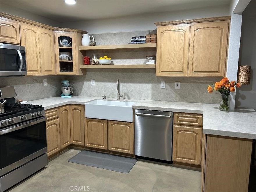 Welcome to this beautifully upgraded and remodeled move-in ready home located in a very desirable Valencia location.  The hand crafted front gate leads you into the front courtyard with ever flowering lush landscaping.  Upon entering the home, you'll note a bright living area which has been opened to the upgraded eat-in kitchen, creating a perfect space for entertaining.  You'll find  high end appliances, farm sink, quartzite counters and back splashes as well as added cabinetry. Presently the home is set up as a two bedroom and den/office space, easily converted, if desired, back to a third bedroom.  Both bathrooms have also been remodeled with upgraded cabinetry and fixtures. The home's interior has been freshly painted in a very neutral color.  Other upgrades include  newer Milgard windows, recessed led lighting, custom flooring and skylights which all  work together to create a well appointed interior.  The two car side by side garage leads directly into the kitchen for your convenience.  There's also room for two cars in the driveway.  Living in this Valencia neighborhood with low HOA fees provides you with miles of paseo walkways, three swimming pool/spa areas and parks.  The home is close proximity to a excellent awarded winning elementary school. You'll also find that it's location provides nearby freeway access, shopping, dining and coffee.