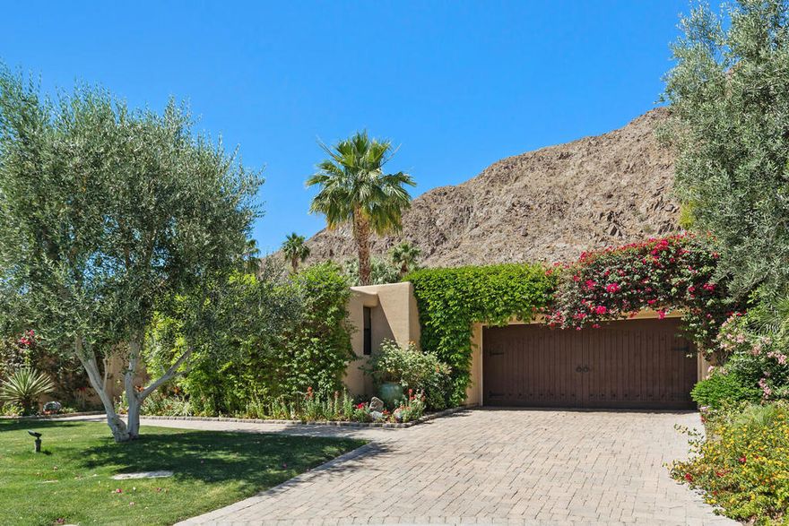 Step into your own private Mountain Resort in this stunning Hacienda-style home now available for lease. The home offers a truly unique and luxurious experience starting with its generous , flowing layout. The spacious living room and dining area and den/media area feature high beamed ceilings and large windows that provide an open view of the sparkling pool and lush landscaping, creating a seamless indoor-outdoor feel. The fully equipped gourmet kitchen is a chef's dream, perfect for creating culinary masterpieces. With four spacious bedrooms, including a private casita, there is plenty of room for family and guests. The large masterbedroom offers a tranquil retreat with a direct view of the gorgeous pool and spa.  The backyard/patio area is a private oasis with a one-of-a-kind waterfall that cascades down a rock feature, creating the illusion that the water is flowing directly from the mountains. This dramatic and peaceful water feature offers a continuous, tranquil soundtrack, transforming the entire outdoor space into a serence escape perfect for relaxation and entertaining.One of the most outstanding features of this home is its secluded location on a quiet cul-de-sac, offering complete privacy and peace.decorated to perfection with hacienda-like furnishings, this home is not just a place to live, but a lifestyle. It also includes a two car garageThe home is adjacent to the La Quinta Resort which has wonderful restaurants, bars and shops. It's also very near Old Town La Quinta which includes more dining venues, bars, shops.Rent from now to December 31, 2025 is $24,000 per month. Rent from January thru April 2026 is $27,000 per month NO PETS