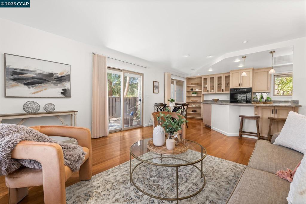 A Downsizer’s Dream in Countrywood! Enjoy the ease of single-story living in Walnut Creek’s beloved Countrywood community. Surrounded by mature trees and scenic trails, it offers a peaceful, park-like setting while keeping you close to shops, dining, and all that Walnut Creek has to offer. This 2BD, 1.5BA townhouse offers a light-filled layout with beautiful hardwood floors in the living area and bedrooms, dual-pane windows, fresh interior paint, recently painted exterior, stylish new light fixtures, updated hardware, and high-quality kitchen cabinetry. Freshly landscaped front and back yards include a private, shaded front patio and a backyard framed by mature trees whose natural essential oils create a calming, spa-like feel. A large 2-car garage with storage organizers adds convenience and functionality. Enjoy the sparkling solar-heated community pool just steps away. Minutes to shopping, dining, top schools, Iron Horse Trail, Heather Farm, playgrounds, dog park, golf course, Bay Club, John Muir Medical Center, Shadelands medical offices, BART, and freeways—this location blends peaceful living with unmatched convenience.