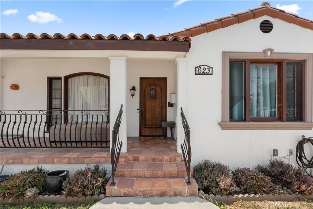A rare find: two fully detached homes on one lot in the heart of San Pedro—perfect for income, multigenerational living, or both. The front home, 623 W 18th Street, is a classic Spanish-style with white stucco, clay tile roof, and a spacious 3-bedroom, 2-bath layout with wood floors, a functional kitchen, and a bright living area. The private, fenced backyard is ideal for relaxing or entertaining, and the basement offers valuable extra storage. A detached two-car garage and a newer roof (installed in 2018) complete the home. The rear home, 621 W 18th Street, built in 2007, offers a 2-bedroom, 2-bath layout with a walk-in closet in the primary suite, in-unit laundry off the kitchen, and gated two-car covered parking for added security and convenience. Each home has a separate entrance, outdoor space, and is fully fenced for privacy. Both are separately metered for gas, electricity, and water—streamlining management and expense tracking. Whether you're looking to live in one and rent the other, house extended family, or expand your investment portfolio, this well-maintained duplex delivers flexibility and long-term value in one of San Pedro’s most loved neighborhoods. Just over one mile from Cabrillo Beach and only one mile from the highly anticipated 42-acre West Harbor development—a future hub for waterfront dining, shopping, and entertainment—this property offers both lifestyle and investment upside.
