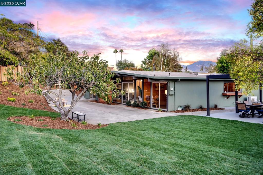 Newly renovated Parkwood Estates Eichler tucked away on one of the community’s most expansive lots! Developed by renowned builder Joseph Eichler and designed by architect Claude Oakland, this coveted model CC-174 has been thoughtfully restored from top to bottom. This mid-century home preserves and restores its irreplaceable original details while seamlessly modernizing for contemporary comfort. Enhancements include brand new kitchen and bathrooms, all new appliances, a stylish mini bar in the bonus room, dual pantry, electric charger, polished concrete floors & fresh paint throughout. Original Eichler features remain beautifully intact, including unpainted tongue-and-groove ceilings, rich mahogany paneling, restored garage and closet doors, Eichler house numbers and the signature atrium. Create lasting memories and entertain with ease in the incredible backyard, complete with a passthrough kitchen, double pergola seating area, covered RV/boat side parking and fruit trees. Additional improvements include new fencing, a stone retaining wall, fresh sod, plants, landscaping, irrigation and hardscaping. With picturesque views of Mt. Diablo, this classic gem is ideally situated by the community park, pool, tennis courts, hiking trails, BART & freeways. Your turnkey dream home awaits!