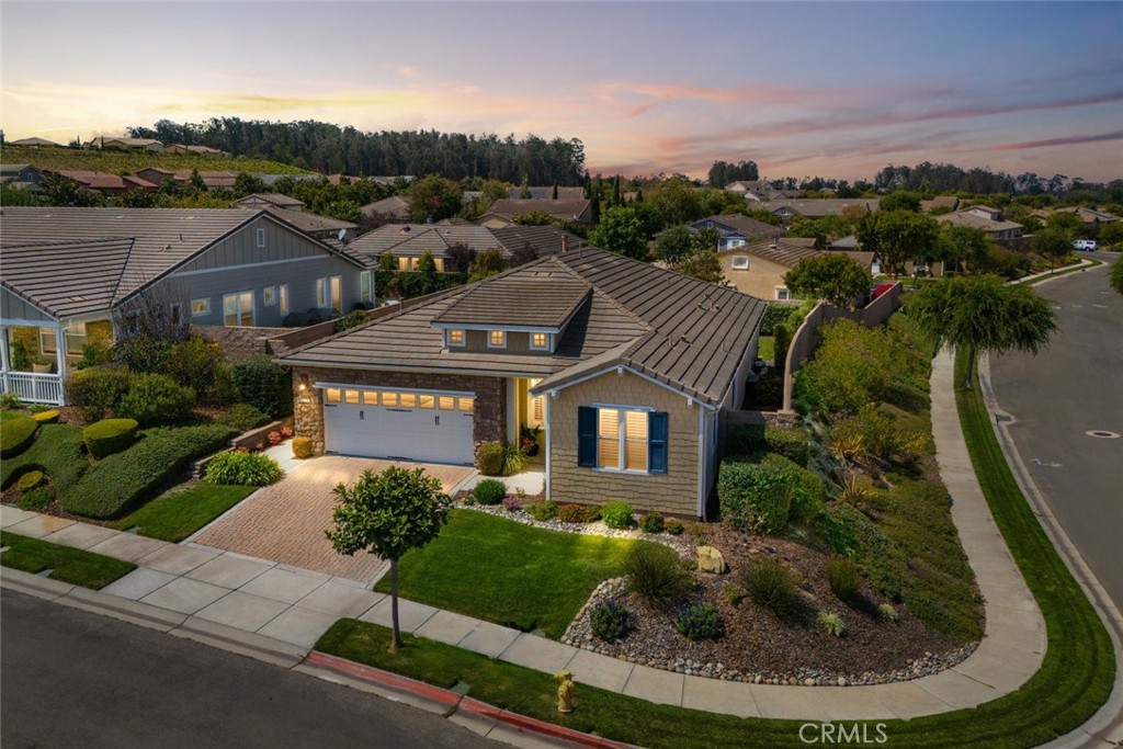 Welcome to this beautifully upgraded home in Trilogy at Monarch Dunes, a premier active lifestyle community on the Central Coast. Perfectly situated on a quiet cul-de-sac corner lot, this residence offers privacy, convenience, and timeless charm.
Step inside to discover an inviting floor plan with luxury vinyl plank flooring, bright white cabinetry, and quartz countertops. The spacious kitchen features a pantry and a charming buffet nook—ideal for a coffee bar or extra serving space.
The home includes 2 bedrooms plus a den, giving you flexible options for an office, hobby room, or guest space. A dual-sided fireplace warms both the den and family room, creating a cozy atmosphere for gatherings or quiet evenings.
Outdoor living is a breeze with a covered patio featuring an overhead heater, perfect for year-round enjoyment. The private backyard retreat provides plenty of space for entertaining or relaxing.
Additional highlights include owned solar panels for energy efficiency and the convenience of a move-in ready condition.
As part of Trilogy at Monarch Dunes, residents enjoy access to world-class amenities including a clubhouse, fitness center, pools, spa, golf, dining, and endless opportunities for connection in this vibrant community.