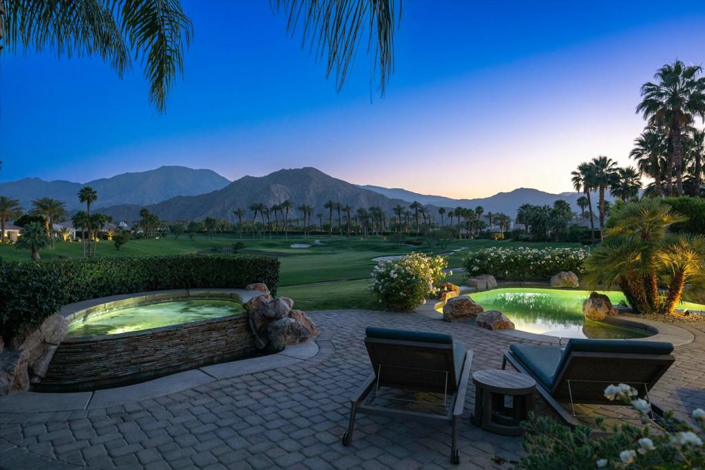 Discover luxury living in this meticulously updated Sedona floor plan, showcasing breathtaking 10th fairway, south mountain, and lakefront vistas. Steps from the clubhouse, fitness center, and Starbucks Cafe Tesoro, this home blends elegance with convenience. Entertain in style on the expansive covered paver patio, featuring a saltwater pool, separate spa, built-in BBQ, retractable awning, patio heater, and chic Restoration Hardware furniture. Recent upgrades include a 2024 pool heater, salt cell, and spa lights. The open-concept kitchen dazzles with custom cabinetry, waterfall quartz counters, a stylish backsplash, and an island breakfast bar. High-end JennAir oven, induction cooktop, microwave, and Sub-Zero refrigerator elevate your culinary experience. The great room impresses with a floor-to-ceiling stone fireplace, built-in media center, bar area with desk, and a wall of glass opening to the outdoor living space. Polished travertine floors grace the main areas, with plush carpeting in the bedrooms. Retreat to the spacious primary suite with direct patio access, featuring black out shades, a spa-inspired bath with custom cabinetry, quartz counters, an oversized walk-in shower, plank flooring, and a generous walk-in closet. Two secondary bedrooms offer ample closets and en-suite baths with walk-in showers. A formal dining room, office, powder room, and laundry room complete the thoughtful layout. Attached two-car garage plus tandem golf cart space with a separate golf cart garage door lets you leave in your golf cart without moving your car. Enhanced security includes exterior cameras. The $545/month HOA provides 24/7 guard-gated security, roving patrols, front yard landscaping, Spectrum internet/TV, and common area maintenance. All residents enjoy a social membership, granting access to the fitness center, classes, spa, community pool/spa, tennis, pickleball, bocce, clubhouse dining, and a vibrant social calendar, for $824 monthly dues. Golf membership available separately.