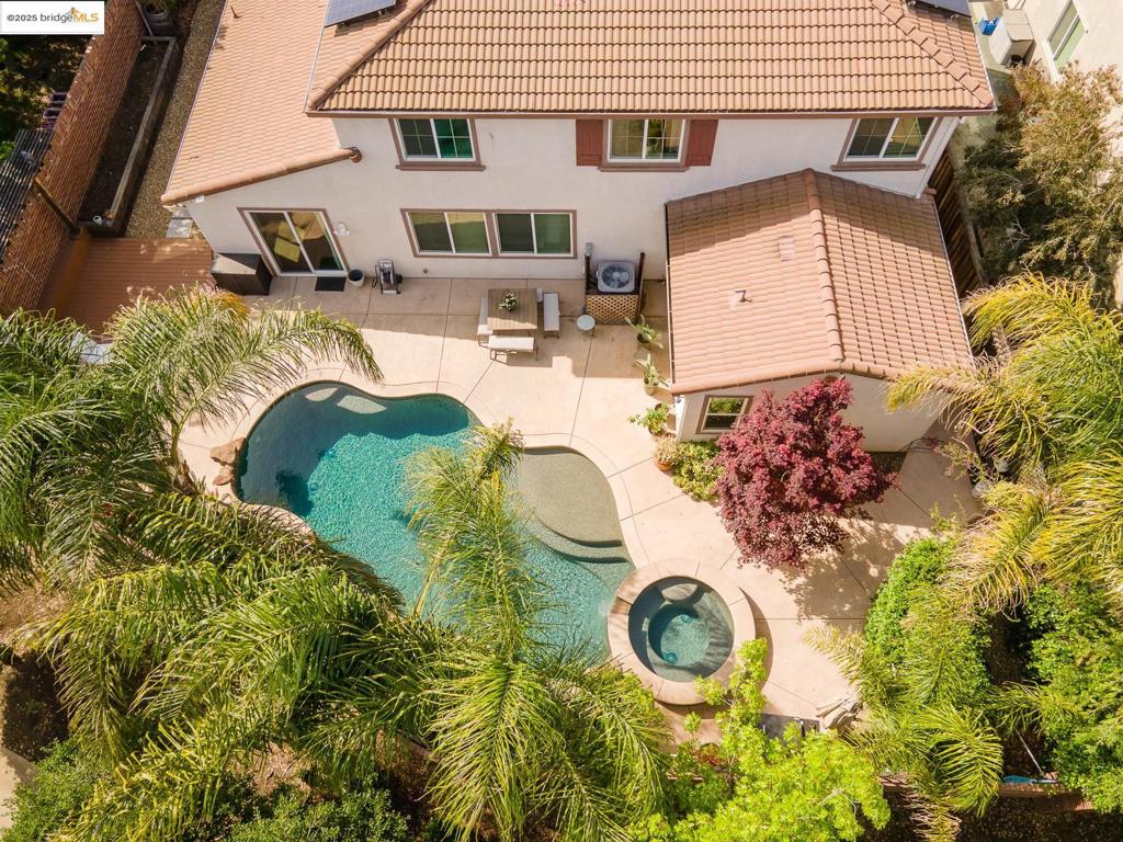This Brentwood Beauty has it ALL! Welcome home to this impeccable 5-bedroom stunner on a quarter-acre lot in the exclusive Carmel Estates with Heritage High School zoning. Perfectly placed in the corner of the community with no neighbors on three sides, you will enjoy access to the parks and walking trails without giving up privacy. With large bedrooms, generous closet spaces, a private sun-filled office and a lofted bonus space, the home offers something for everyone. The main-floor primary retreat is tucked into the quiet corner of the house with a soaking tub, stall shower, and the enormous closet you have dreamed of. The three-car tandem garage with epoxy flooring has room for all of your projects. Every room is updated and attractive, offering views of the lush landscaping. The backyard is the perfect place to relax and entertain with an inground PebbleTec pool and spa including a waterfall, a raised deck to enjoy the views, and garden planter boxes right outside the kitchen window. Come and see!