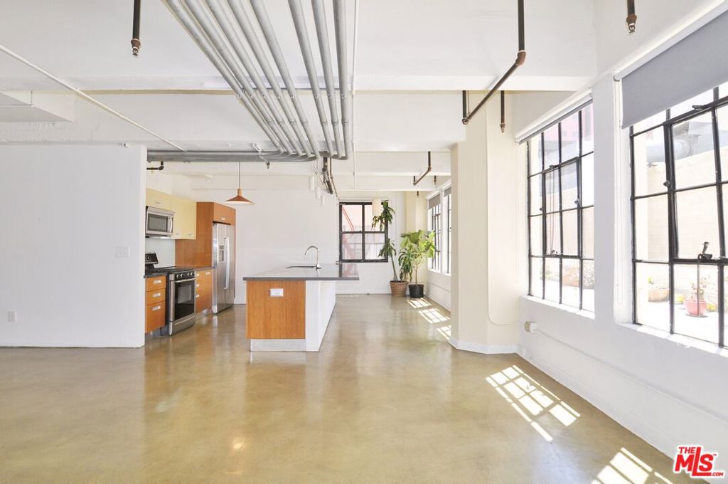 Historic 1 bed 1 bath live/work loft in the Cornell Building, in the heart of the Fashion District. Formerly a turn of the century textile building, this amazingly bright and airy south facing loft is located within blocks of all the DTLA hotspots. The open plan loft is 770sf, has 1 bedroom, 1 bath layout with concrete floors, soaring 10'+ ceilings and massive vintage factory windows along the entire side of the living room and kitchen. The galley kitchen is equipped with stainless steel fridge, dishwasher, oven, microwave, and plenty of storage. The spacious bedroom or office area has an exposed brick wall. Bathroom has a full soaking tub and shower, as well as side-by side Washer/Dryer. Central heat/AC throughout. Rent includes water, trash, gas. Amenities for residents include a rooftop pool, rooftop hot tubs, gym, rooftop basketball court, and 24/7 building security patrol. Within blocks to all the best of DTLA, including Whole Foods, Apple Store, The Broad, City Market South, Walt Disney Concert Hall, Bendix Art Space, IL Caffe, Per La Hotel, Civil Coffee, Cliftons, The Bloc, Fig&7th, Crypto.com Arena, Rossoblu, Dama, Verve, Little Sister, Poppy & Rose, Broken Mouth, Holy Basil, and tons more.