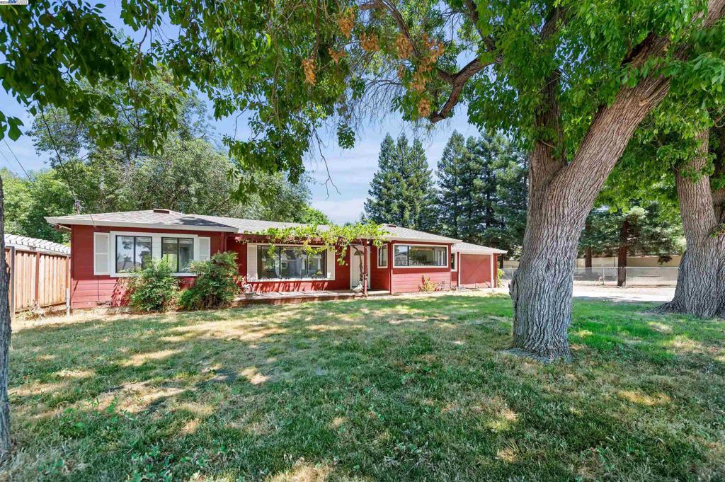 This property is located in the unincorporated part of Pleasanton .Located one block from the city of Pleasanton.This country setting on a gravel road has 2 bedrooms and 1 and a half baths on a large lot. Fenced on three sides with many mature trees .The lot next door is for sale MLS#41105553 lot line is marked by spray paint and not surveyed