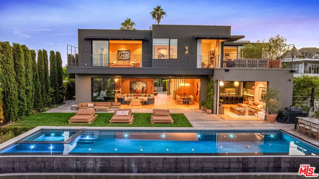 Masterfully designed by HEH in collaboration with Von Studnitz Architects and Studio Preveza, this home is situated on a private cul-de-sac on one of the most coveted view streets in Bel Air. Inspired by James Perse design elements, the residence is a canvas for the quintessential California lifestyle and is perfect for entertaining. Gated and private, this home delivers warm, high-end finishes throughout its open-concept floor plan, thoughtfully designed to maximize city & ocean views. Featuring 6 bedroom suites, including the luxe primary & guest quarters with separate entrance, as well as a state-of-the-art kitchen & multiple living spaces that flow to the exterior where a 50-ft infinity-edge pool and hillside backyard with citrus grove, French lavender & Tuscan rosemary create an urban oasis. Additional luxuries include a home theater, gym, 3-car garage & motor court. This home sets a new benchmark for modern comfort in a desired locale. Offered fully furnished!