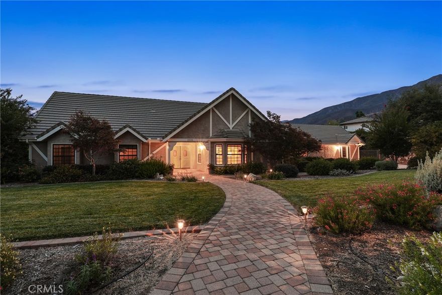 Experience the luxury & glamour of this unique single-story estate. Private San Antonio Heights retreat has a stunning view of the San Gabriel Mountains & sits on 40,400 sqft (.92 acre) spacious lot. Professionally landscaped estate front yard has drought tolerant native plants, a drip system, & curved Angelus paver walkways leading to the double door entry. Once inside, you will enjoy the open floor plan with a huge formal dining room to accommodate warm gatherings with a large used brick fireplace. Gourmet delight U shape kitchen features plenty of cabinetry, granite counter tops & subway tile, 12 ft breakfast bar, Rev A Shelf under counter dual waste basket system, stainless steel appliances, gas stove/range, dishwasher & newer Panasonic built-in microwave. Spacious kitchen opens up to a multi-use great living room. The north end of this estate is set up perfectly for mother-in-law/guest quarters with separate entry, another lovely used brick fireplace & wet bar with under cabinet refrigerator for a mini kitchenette area if needed. Features: approx. 3,077 sq.ft. of spacious living space, 5 bedrooms, 3 upgraded baths, designer paint, refinished smooth ceilings, vaulted ceilings, recessed lighting, custom base moldings & door casings, ceiling fans, 2 fireplaces & 2 wet bars, built-in desk off the kitchen, laundry room, 2 zones for A/C and heating, Milgard dual pane vinyl windows & sliders, Cat-5 network cable throughout the house, EagleLite concrete tile roof with warranty, three attic fans with thermostat control, Quiet Cool whole house fan & much more! Spacious primary bedroom with primary bath featuring dual sinks & custom Corian vanity area. Resort like fully fenced backyard showcases view of the beautiful mountains to the north as well as the valley to the south. Large Alumawood solid patio cover with light strips, 7 custom pull down shades & fans for your enjoyment. Saltwater Pebble Tech pool with Baja shelf & 3 umbrella sleeves plus electric pool cover. Basketball court area, umbrella sleeves installed on the surrounding pool deck & back patio area with fire pit, Premier PRO Ranch Tuff Shed, detached two car garage with shelving, plus two separate carports. Lots of parking including plenty of room for your RV, boat or toys. This property is conveniently located close to the Colonies Crossroad center which offers shopping & restaurants. Commuter friendly with 210 freeway near-by & the Metro Link station in the downtown Upland Village plus much more!