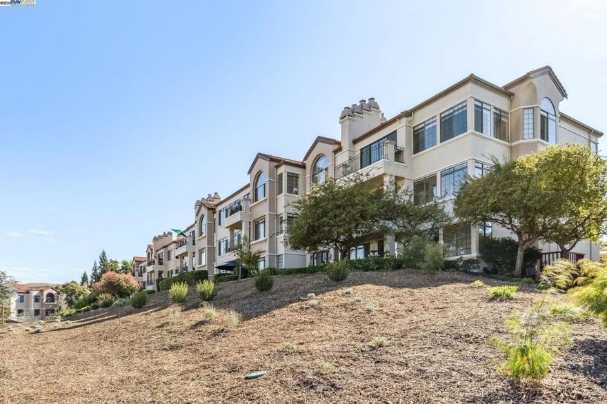 Beautifully updated 3-bed, 2-bath condo with expansive lake views from the living room, dining area, and primary suite. This light-filled, move-in ready home features a chef’s kitchen with island seating, breakfast nook, open dining area, and a new dishwasher & electric range/oven. The spacious living area includes large windows, a cozy fireplace, and built-in bar—perfect for relaxing or entertaining. The primary suite offers tranquil lake views, dual sinks, a walk-in closet, and a private bath. Two additional bedrooms provide versatile space for guests, a home office, or hobbies. Additional highlights include in-unit laundry and an oversized 2-car garage with ample storage. Located in a secure, gated community with elevator access and resort-style amenities: 4 pools with spas, tennis and pickleball courts, scenic walking trails, and 24-hour staffed security. Conveniently located near top-rated schools, shopping, dining, and major freeways.  OPEN HOUSES:  10/11 & 10/12 2-4pm!