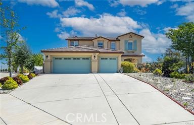 Perfect View! this home offers stunning panoramic mountain views that truly set it apart. The gentle winds from the Ortega mountains create a pleasantly mild climate, making this area exceptionally comfortable to call home. fruit trees to reach the front door, you'll immediately notice the openness and brightness of the living space. This immaculate residence boasts 4 bedrooms, 3 bathrooms, with hardwood flooring in the living room, ceramic tiles in the kitchen, and brand-new carpeting in the family room. The kitchen stands as a testament to culinary excellence, equipped with a granite countertop island and sleek stainless steel appliances. Parking is a breeze with a spacious 3-car garage and an expansive driveway, ensuring ample space for all your vehicles. One of the garages could easily be converted into a bedroom. Ascend to the loft upstairs, a versatile space ready to adapt to your lifestyle needs. Each of the 4 bedrooms offers captivating views, with the master bedroom balcony offering a picturesque glimpse of a serene lake, adding an extra layer of charm to the second-floor scenery. Conveniently located just over 20 minutes from the Temecula wine country in Southern California, and a mere mile from the 15 Freeway, this home offers the perfect blend of tranquility and accessibility. Don’t miss out!