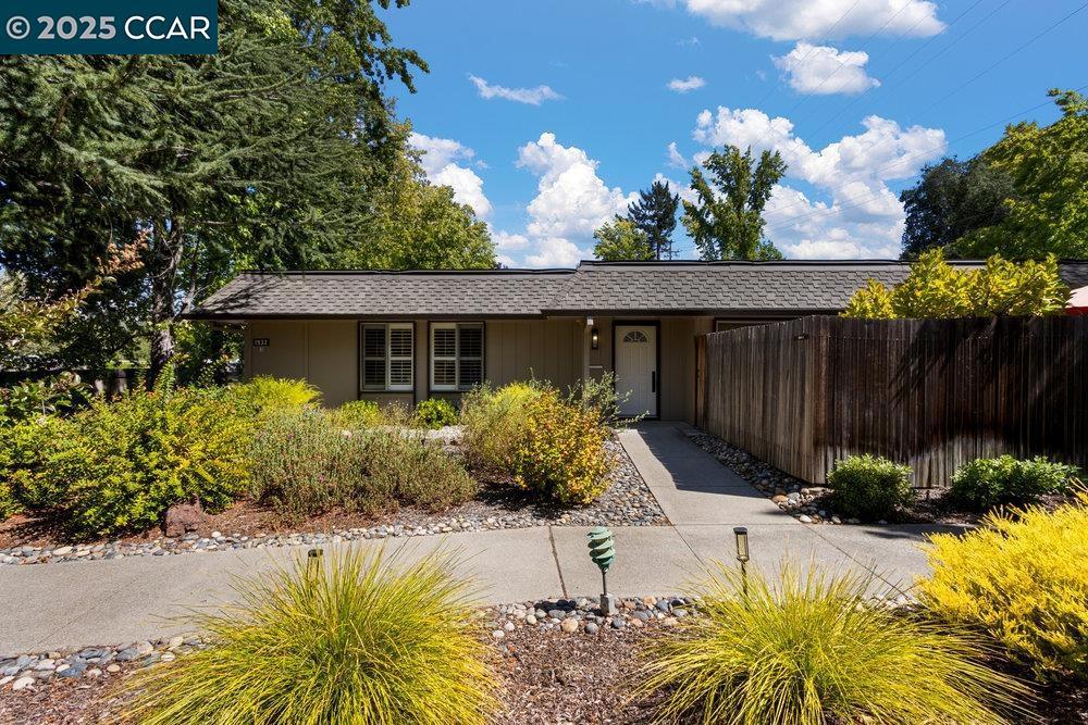 Welcome to this rare level-in Santa Cruz model with opportunity for a private GARDEN! An elegantly remodeled 3-bedroom, 2-bath home with no stairs and thoughtfully selected finishes throughout. Located at the end of a lovely tree-lined entry in Entry 13, this home combines style, comfort, and convenience in one of the Bay Area’s most vibrant 55+ communities. It's everything you've been hoping for! Step inside to wide-plank French Oak engineered hardwood floors, recessed lighting, and natural light from multiple skylights. The open-concept layout connects the living room, dining area, and a stunning kitchen featuring all-new appliances, quartz countertops, custom cabinetry, a center island, and sleek fixtures, perfect for daily living or entertaining guests. Both bathrooms have been beautifully updated with designer tile, modern vanities, and statement mirrors. Full-size indoor laundry, a private fenced patio, and effortless access to carport parking and storage (Carport #25) add everyday ease. Beyond the home, Rossmoor offers an unmatched lifestyle with access to golf, tennis, swimming, pickleball, bocce ball, fitness centers, clubhouses, a movie theater, and over 200 social clubs and organizations.